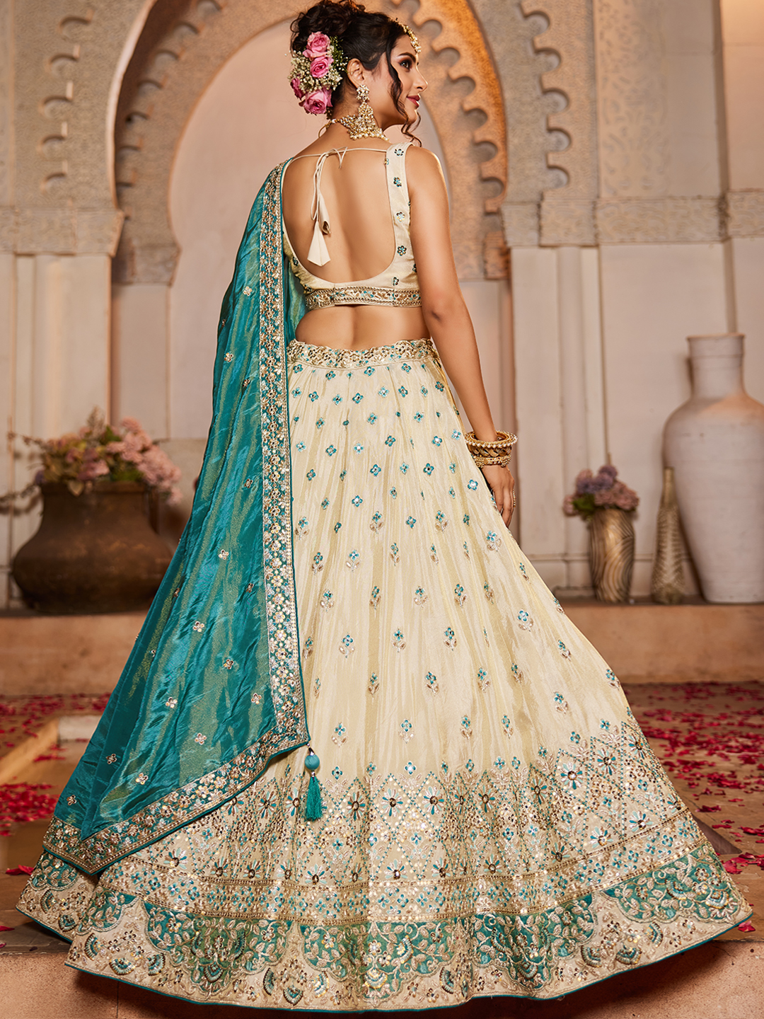 Make a statement as a fashion-forward bridesmaid in this chic cream lehenga set