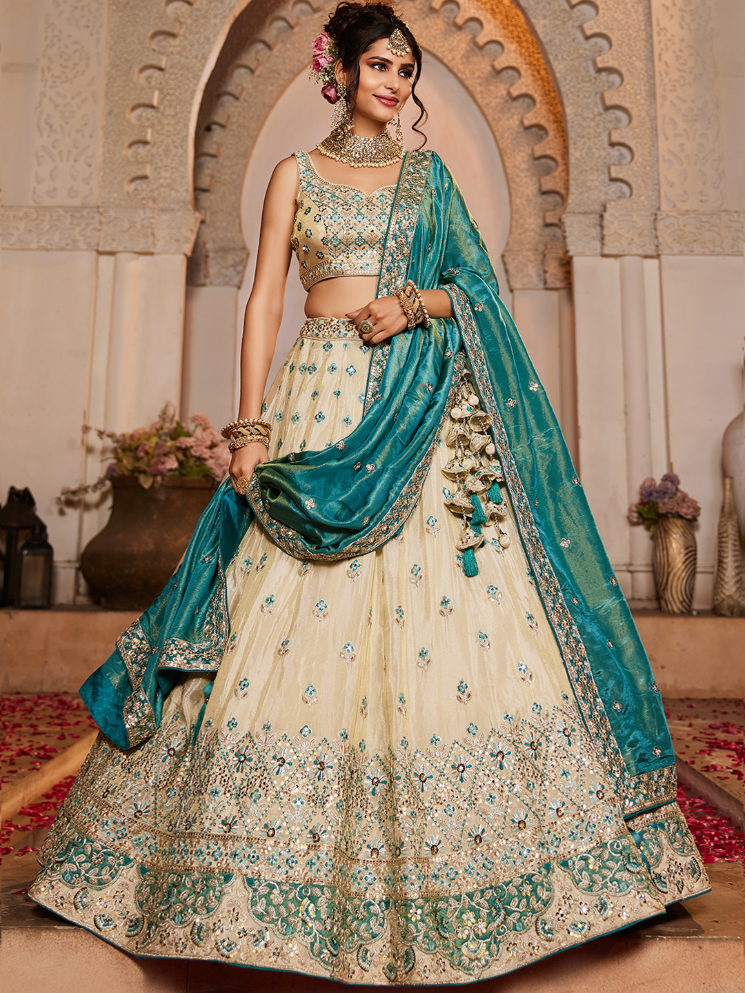 Make a statement as a fashion-forward bridesmaid in this chic cream lehenga set