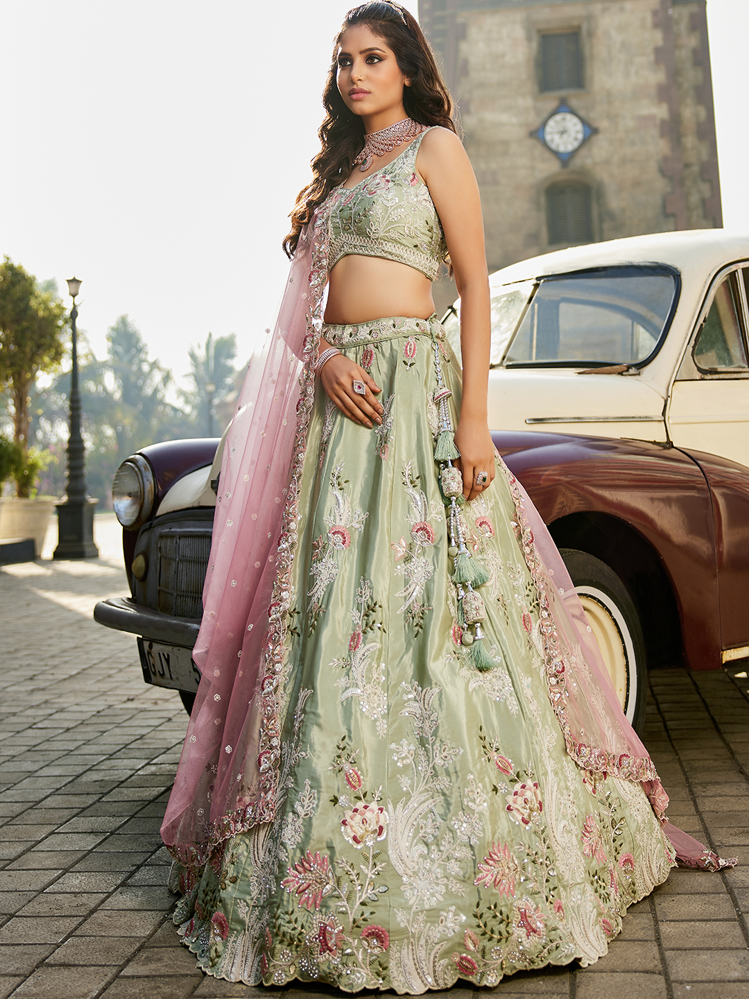 Step into the spotlight with this luxurious pistachio green satin lehenga