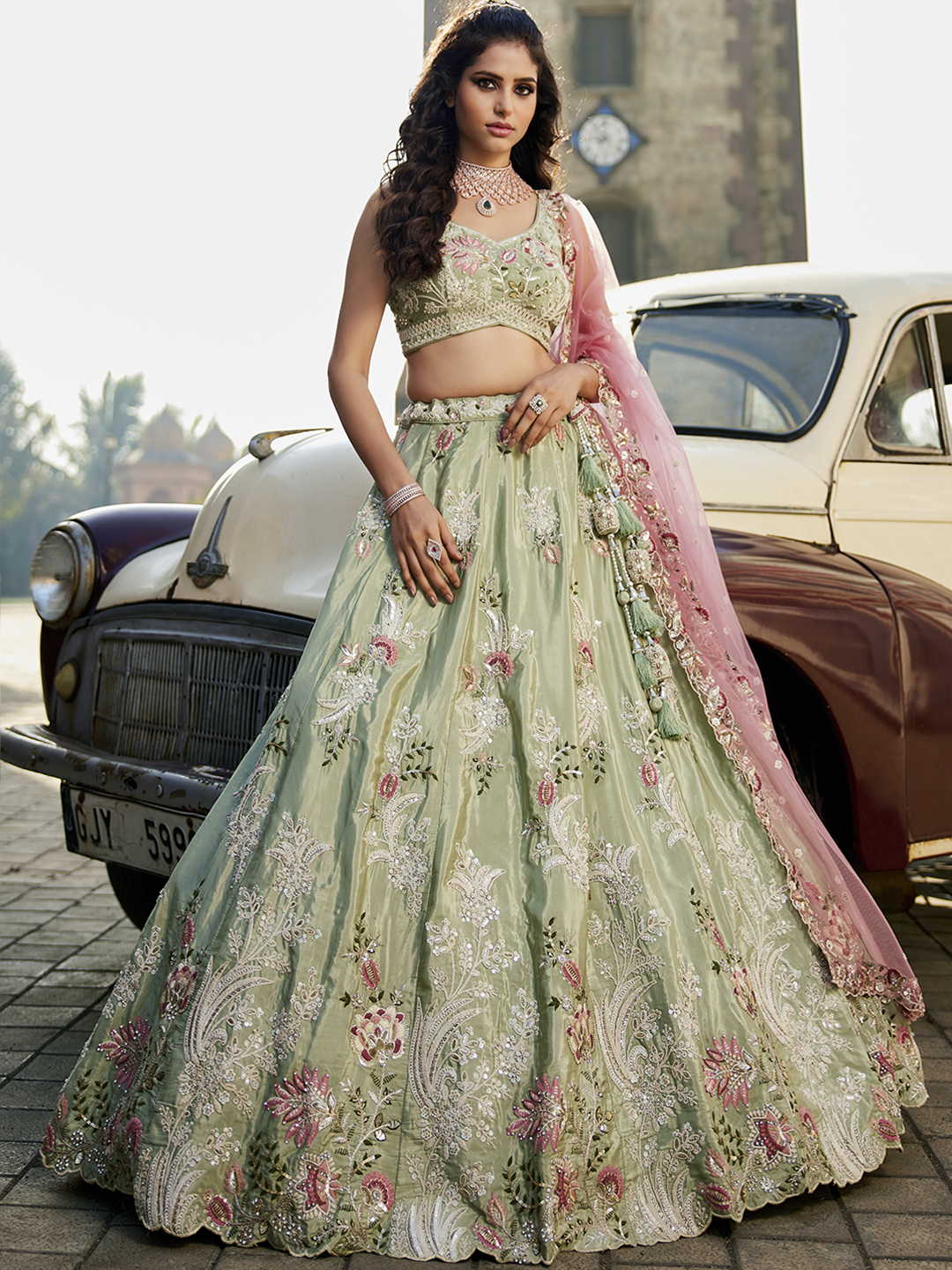 Step into the spotlight with this luxurious pistachio green satin lehenga