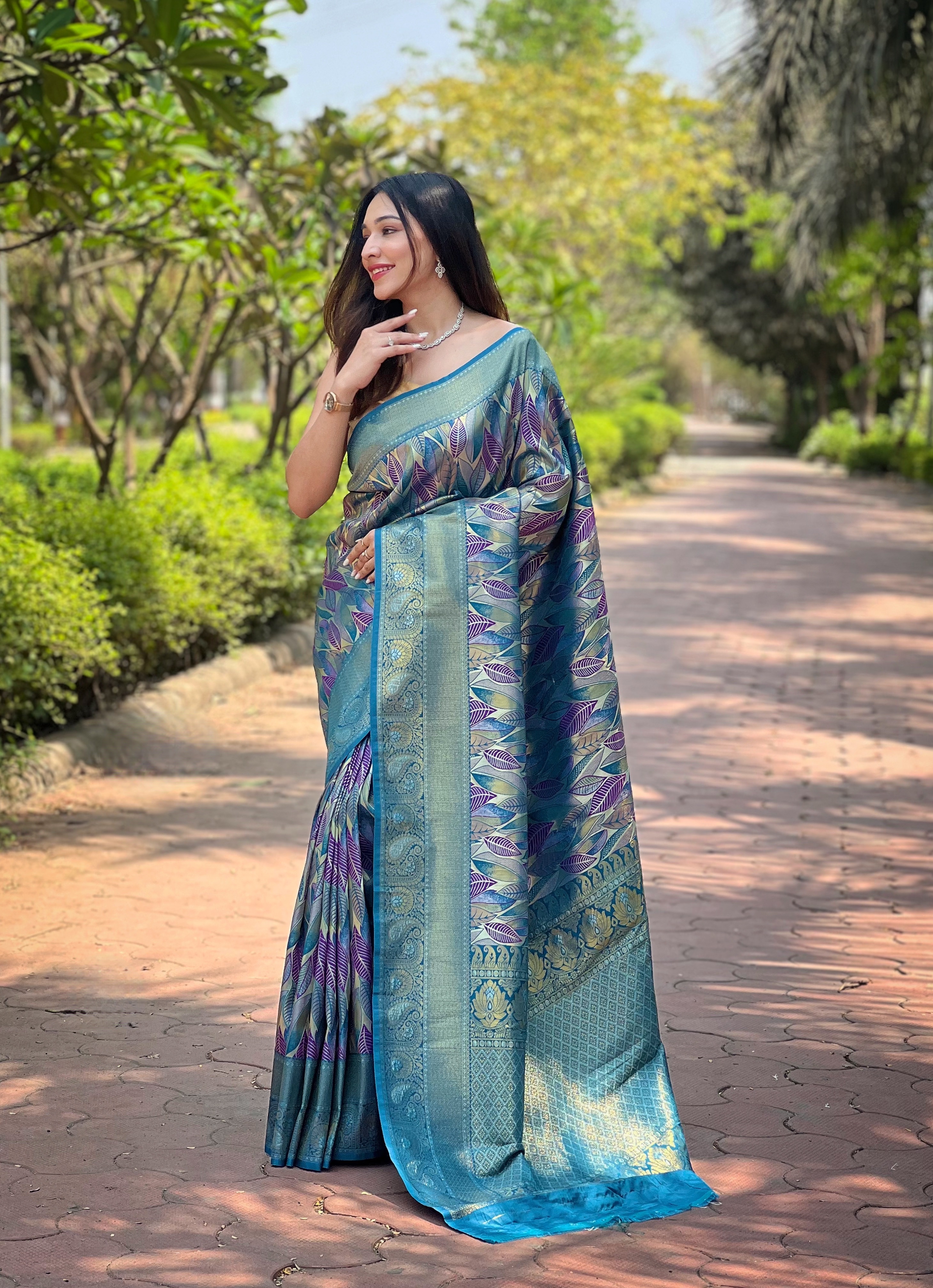 A Majestic Symphony in White Teal Kanchi Pattu Silk Saree