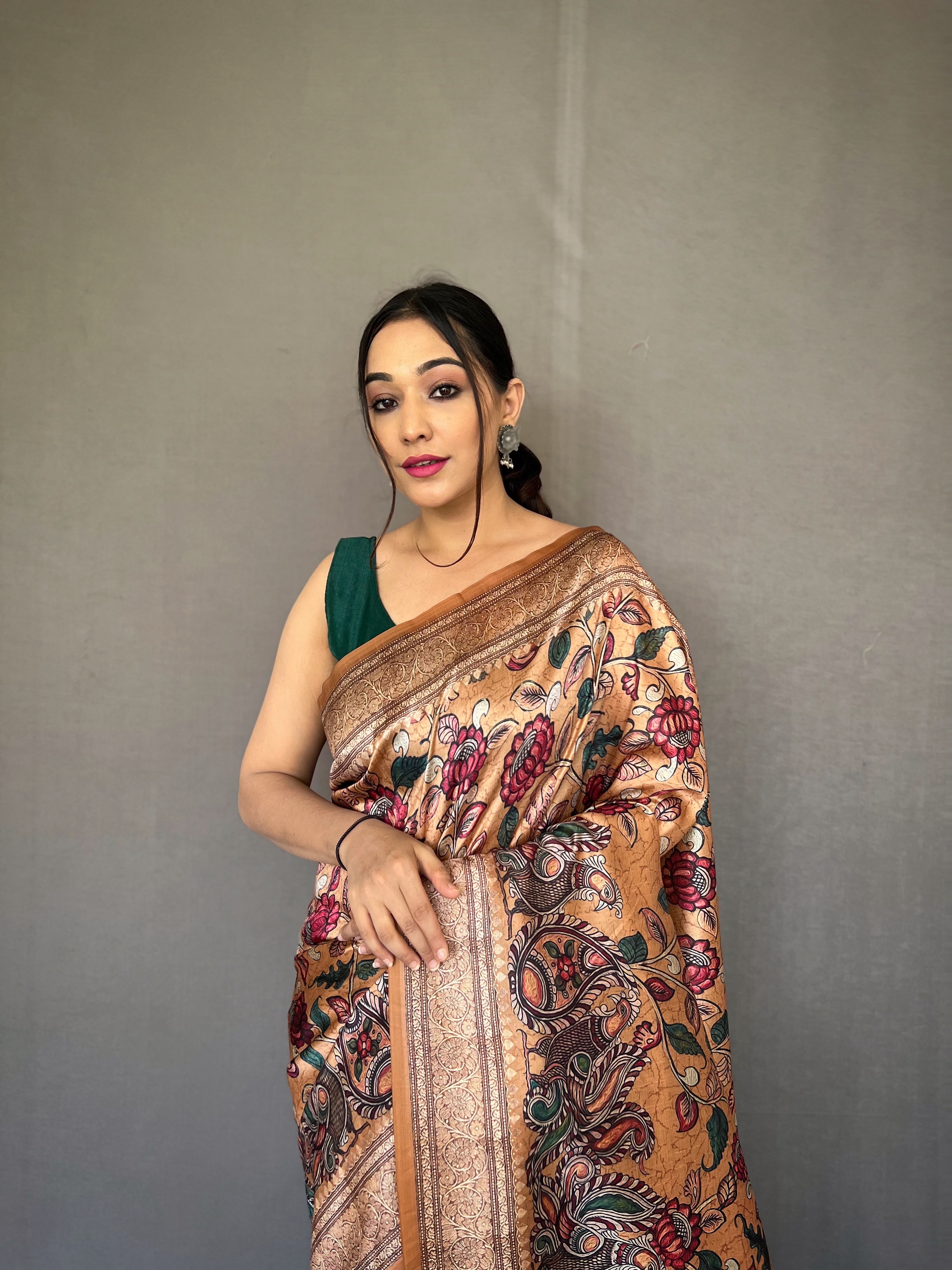 Embrace the richness of tradition with our Golden Soft Silk Kalamkari Saree