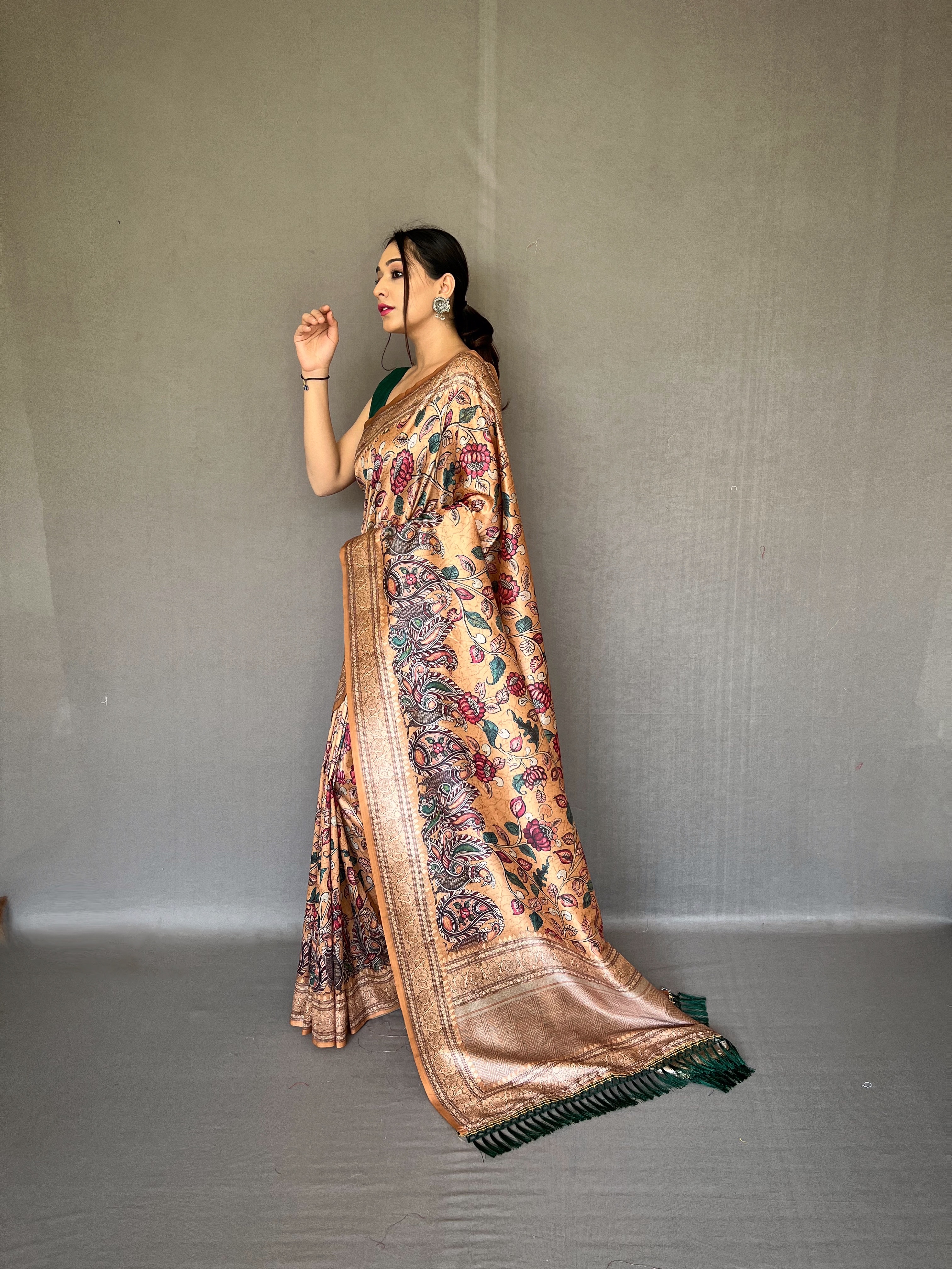 Embrace the richness of tradition with our Golden Soft Silk Kalamkari Saree