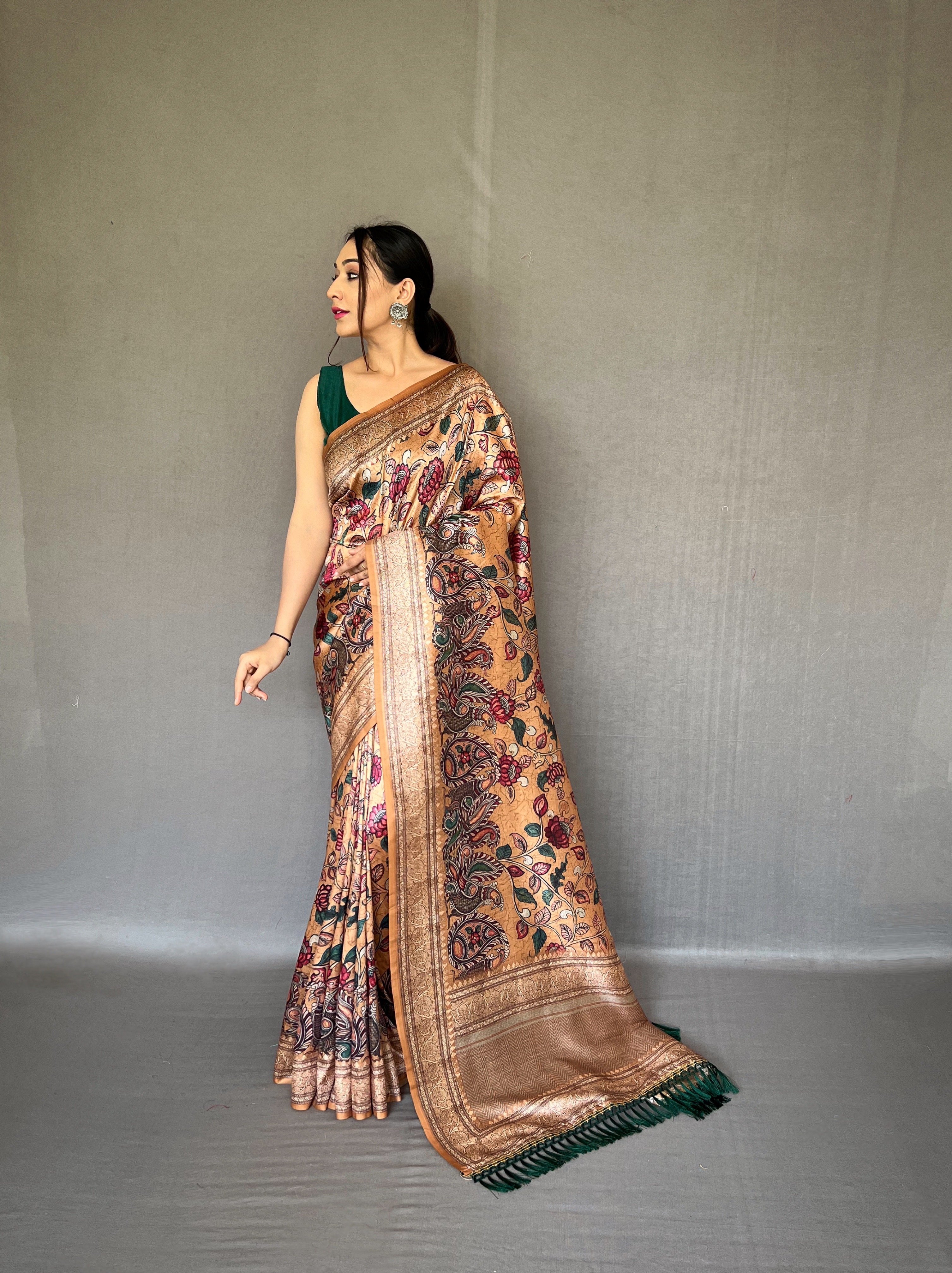 Embrace the richness of tradition with our Golden Soft Silk Kalamkari Saree