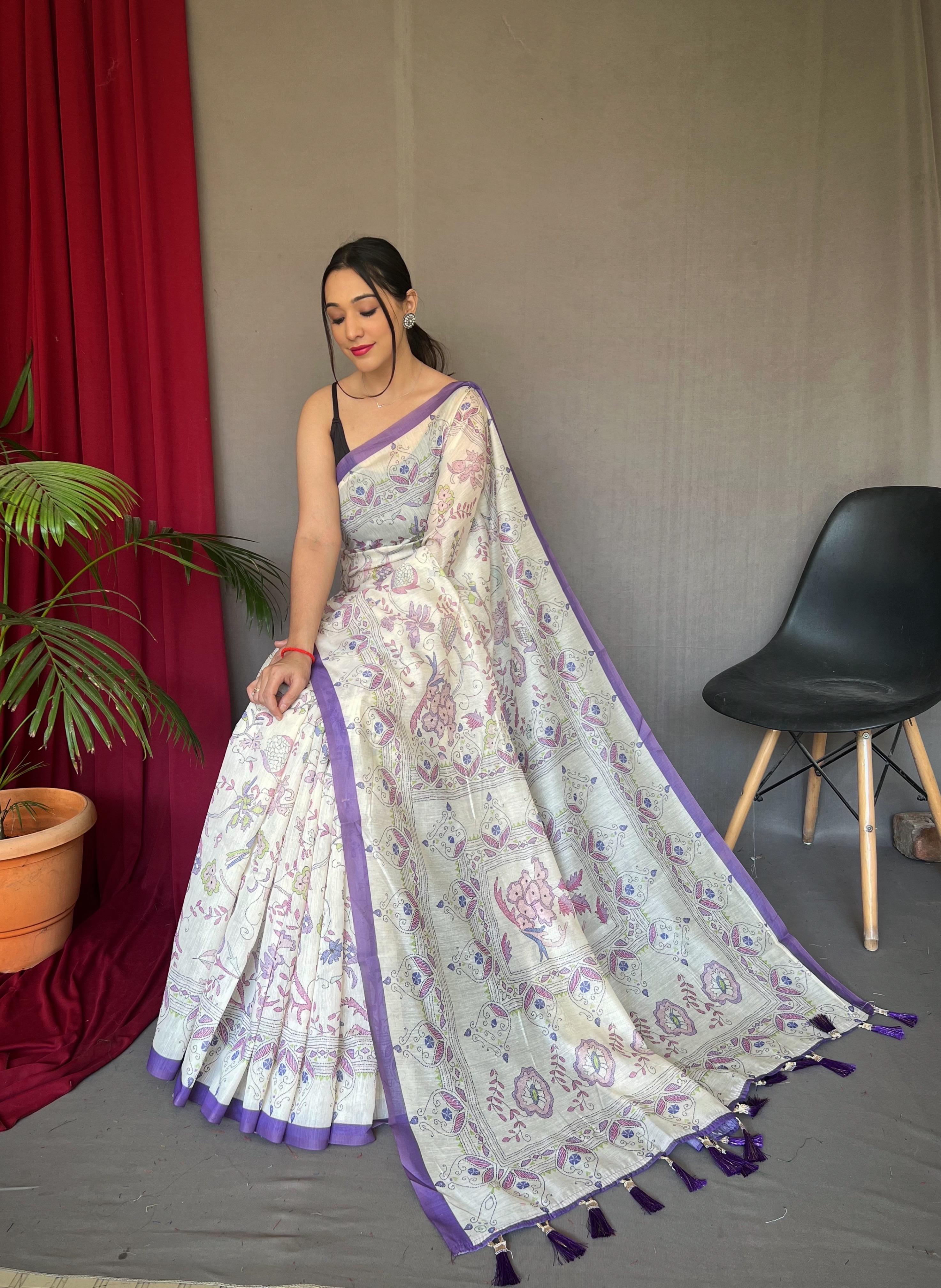 Embrace effortless grace with our White Malai Cotton Printed Saree with Purple Border