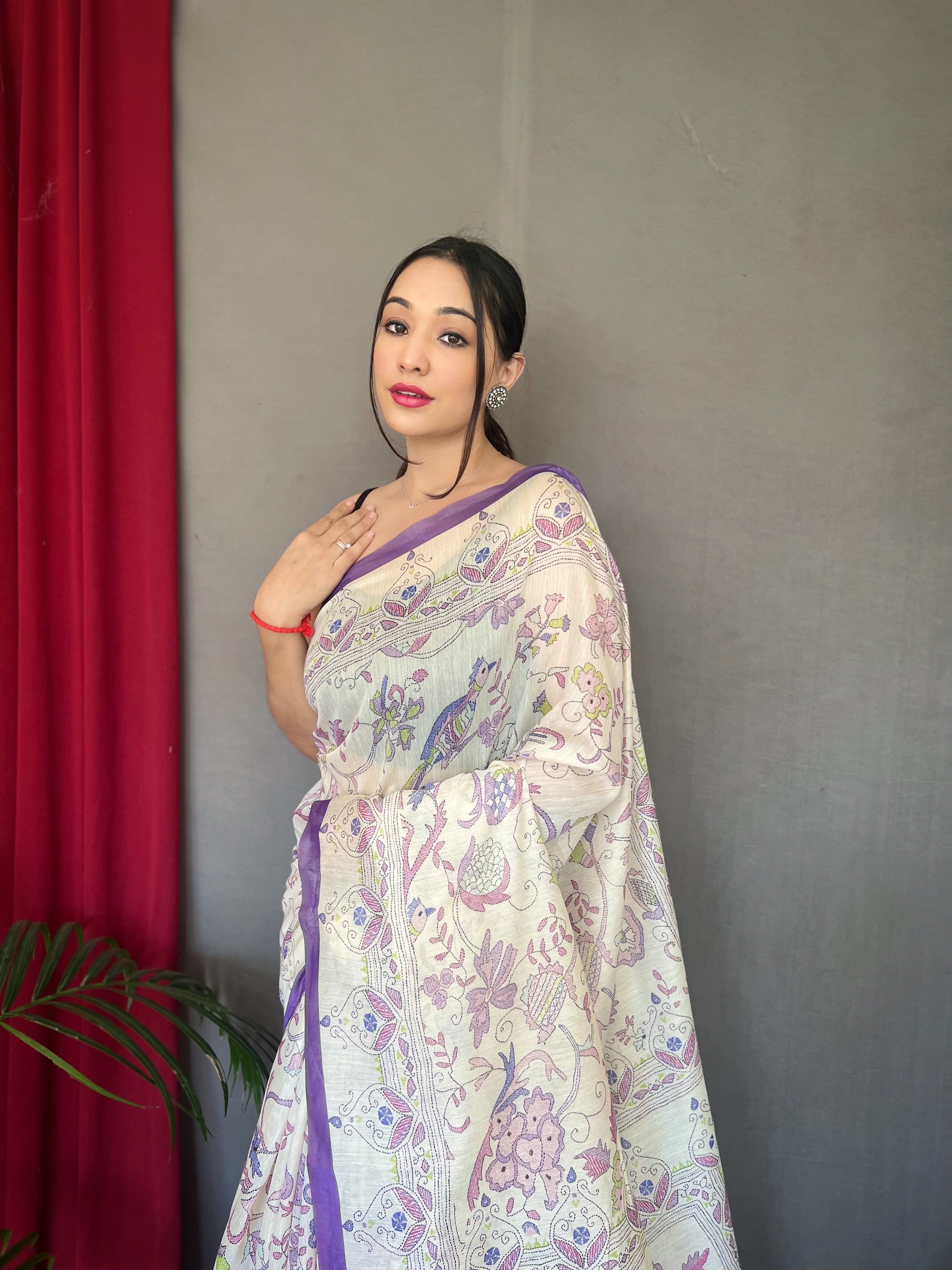 Embrace effortless grace with our White Malai Cotton Printed Saree with Purple Border