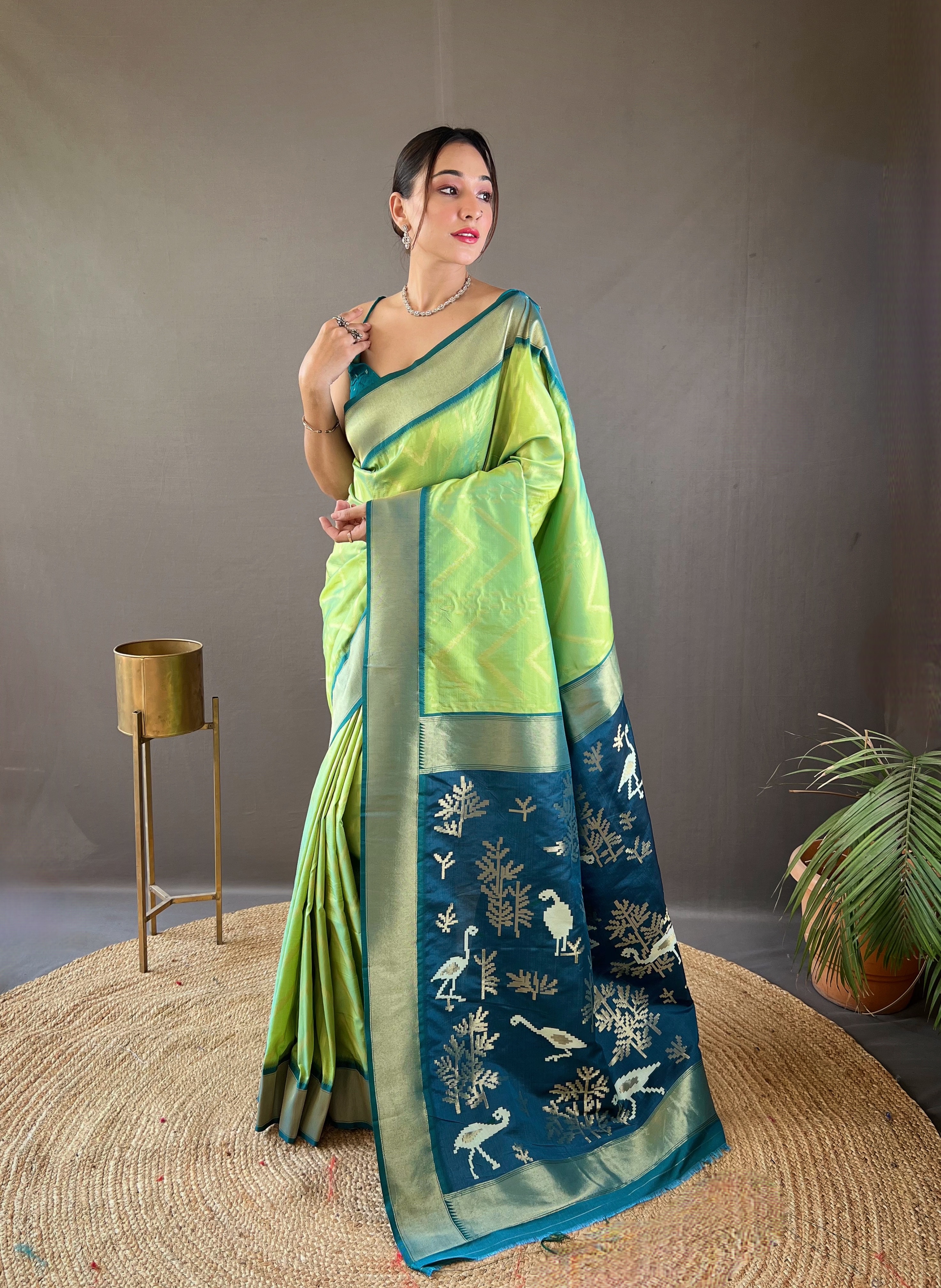 Make a striking statement with our Parrot Green Soft Silk Saree