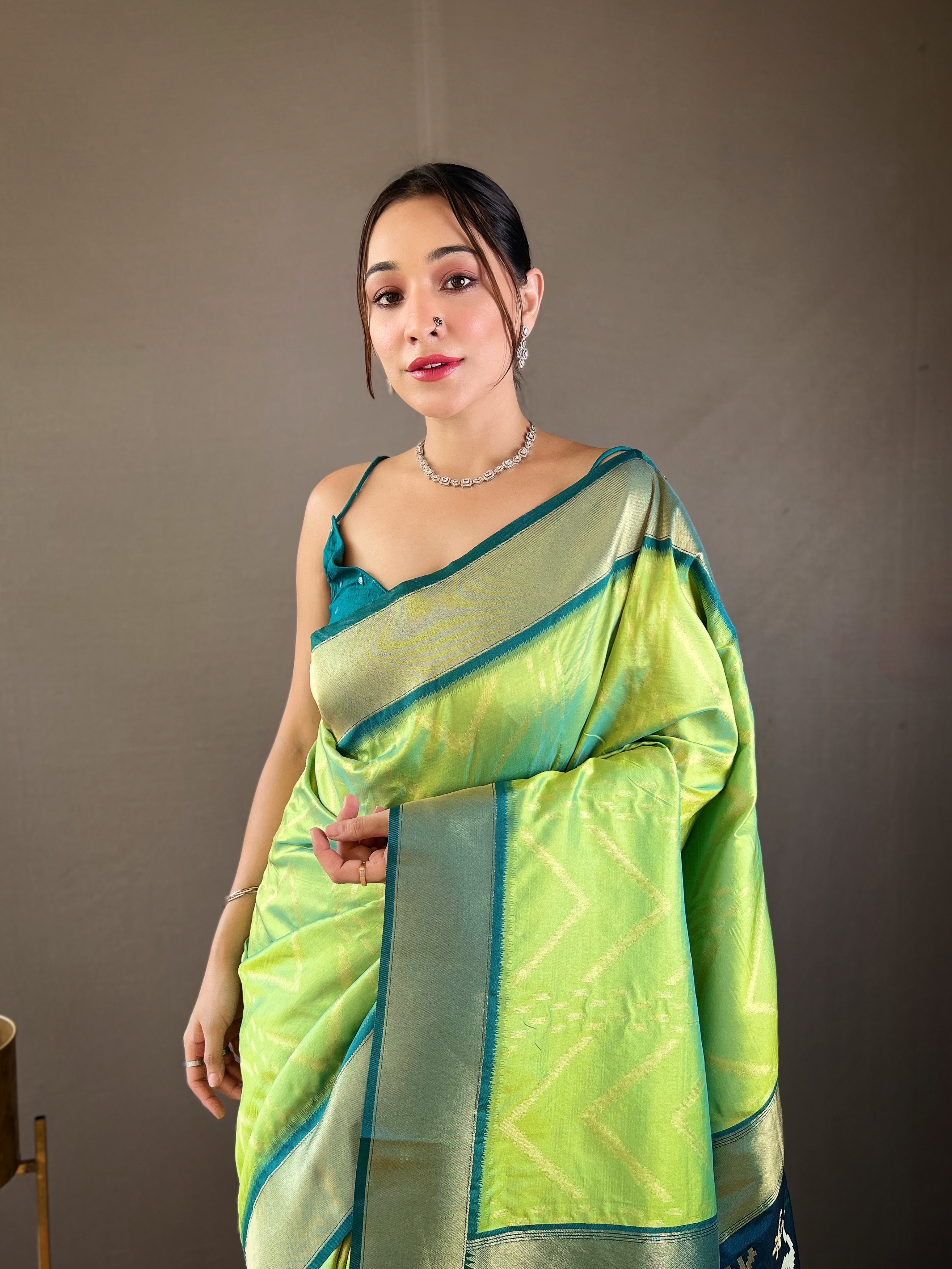 Make a striking statement with our Parrot Green Soft Silk Saree