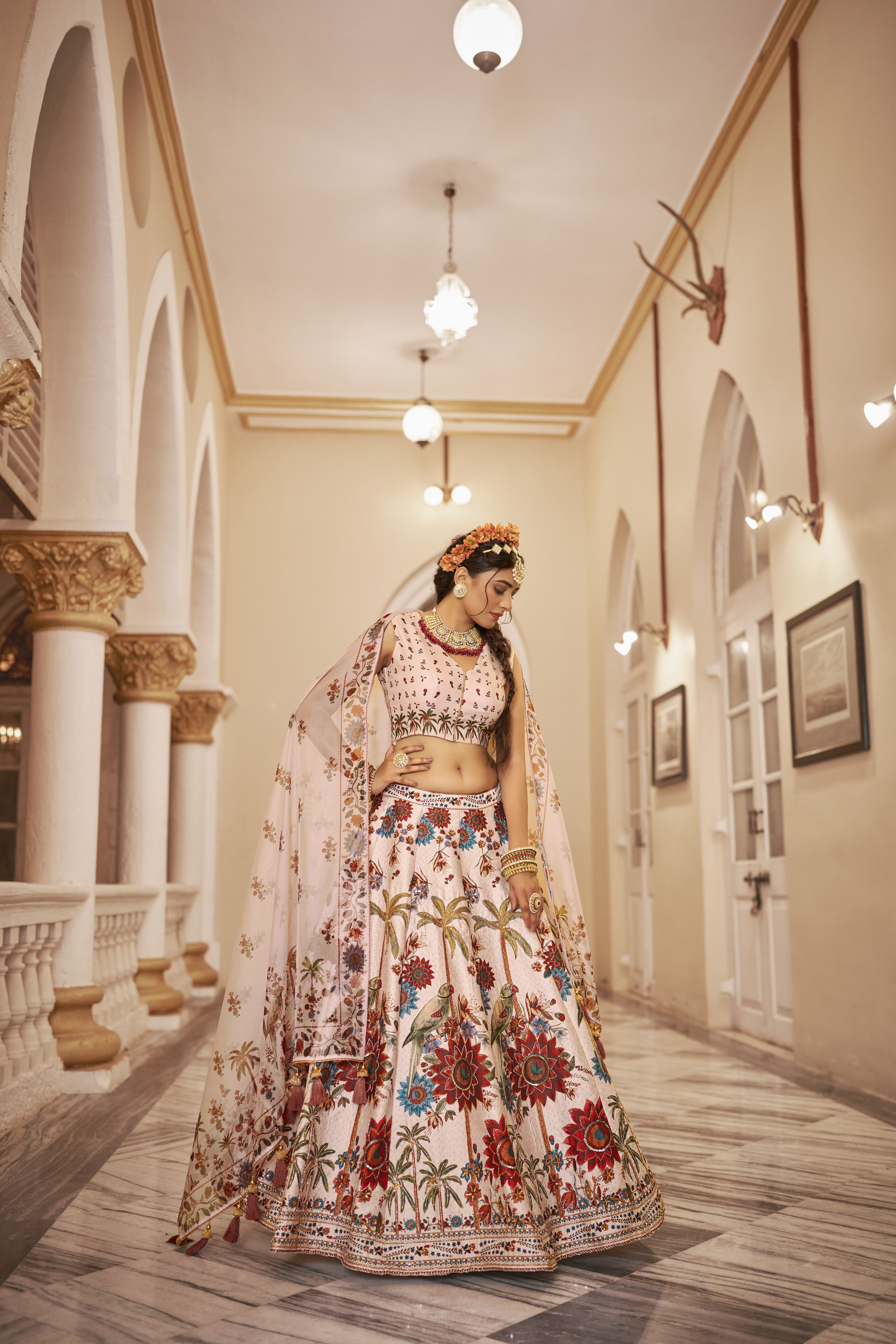 Elevate your ethnic wardrobe with this stunning off-white lehenga set
