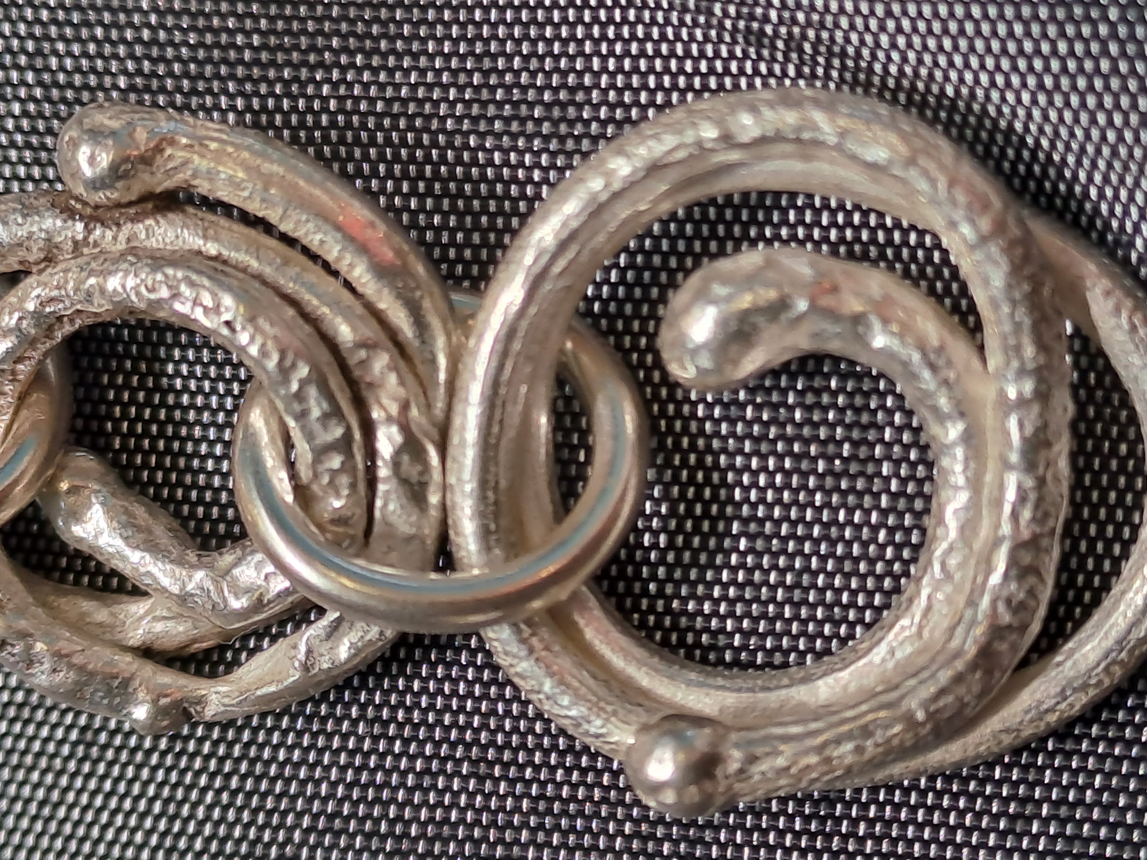 Silver Spiral Dangle Earrings with a molten and reticulated texture