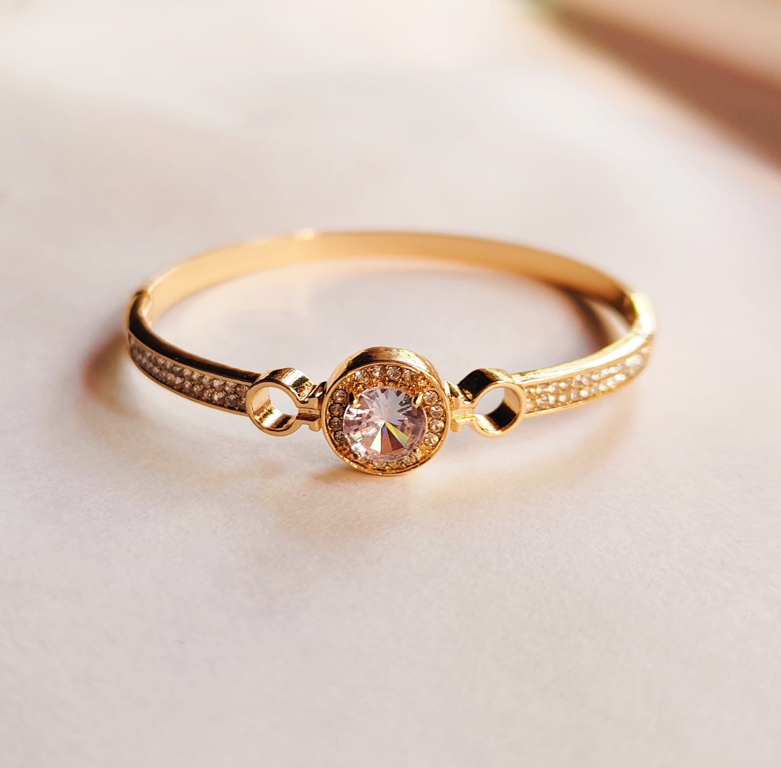 Elegant Gold Bracelet with Roman Numerals and Gemstones