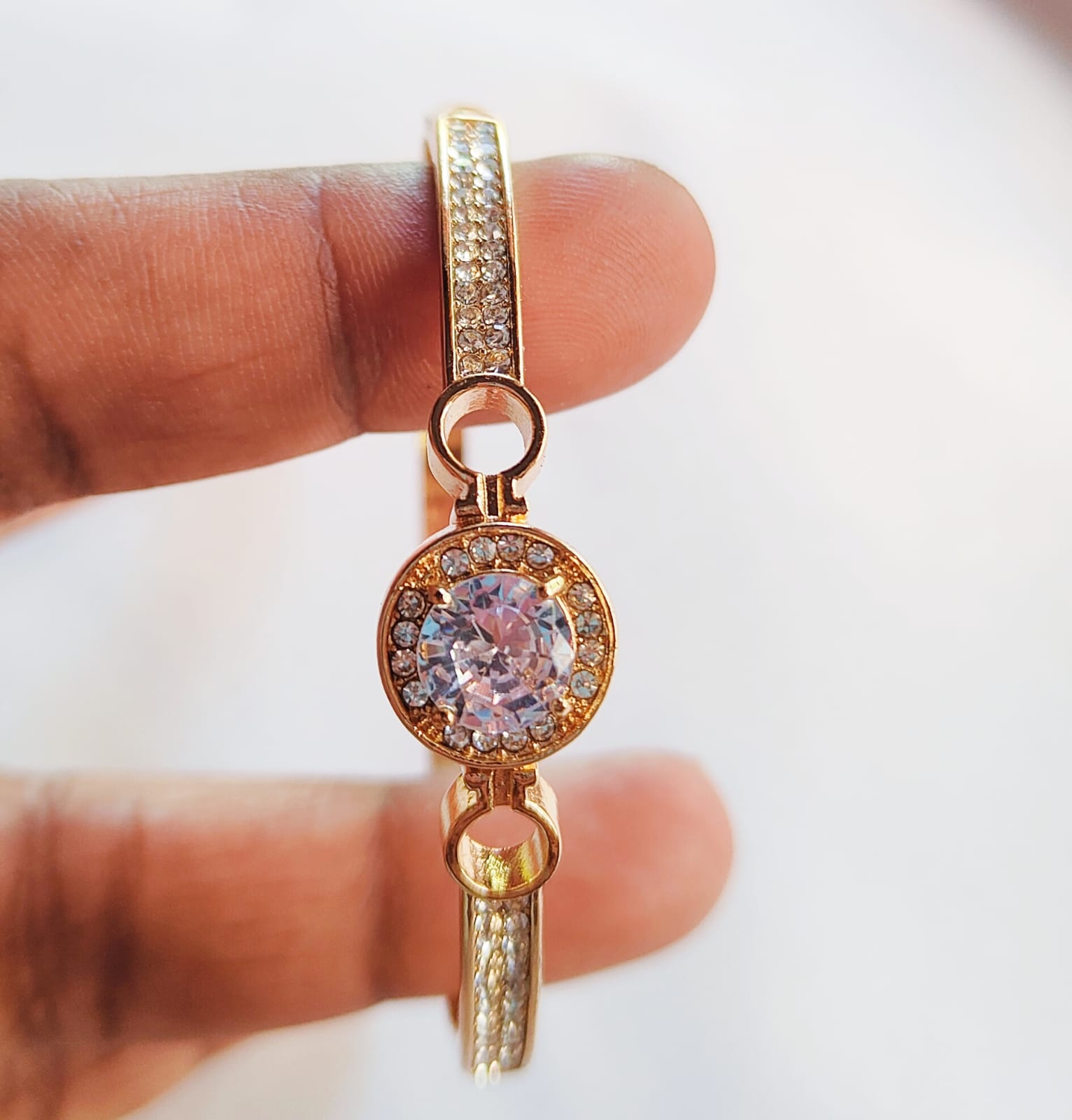 Elegant Gold Bracelet with Roman Numerals and Gemstones