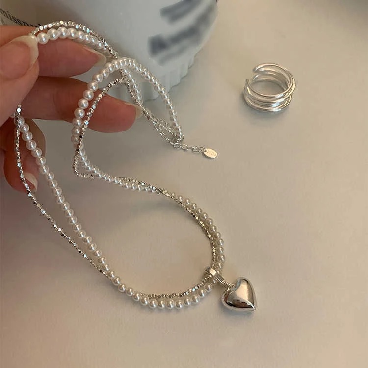 Collier en perles avec pendentif cœur