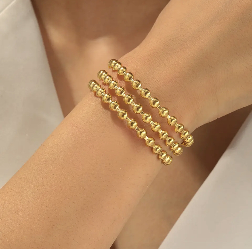 Bracelet à perles dorées