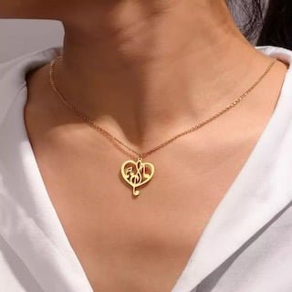 Collier en or avec pendentif coeur musique 