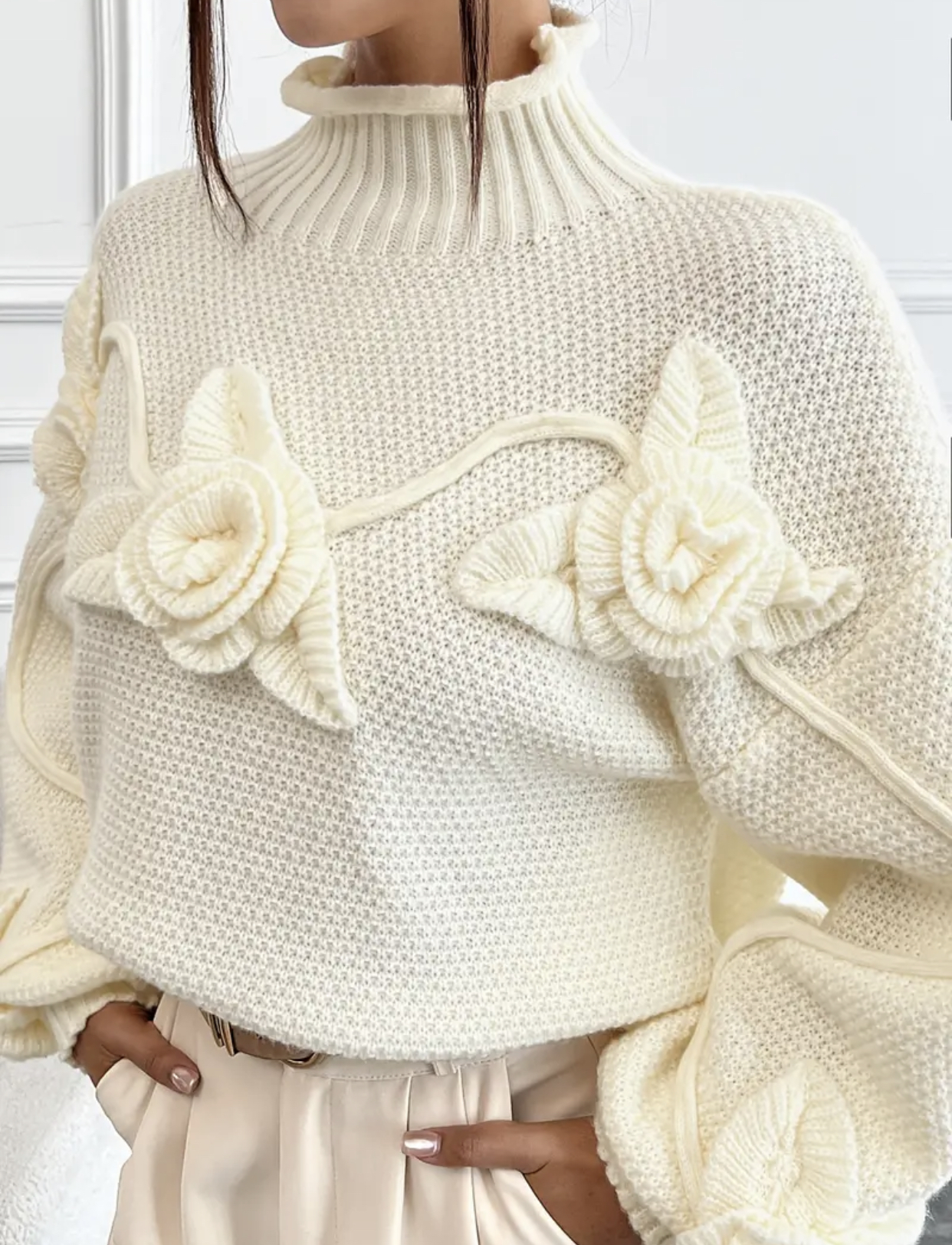 Pull Rosa tricoté avec des fleurs
