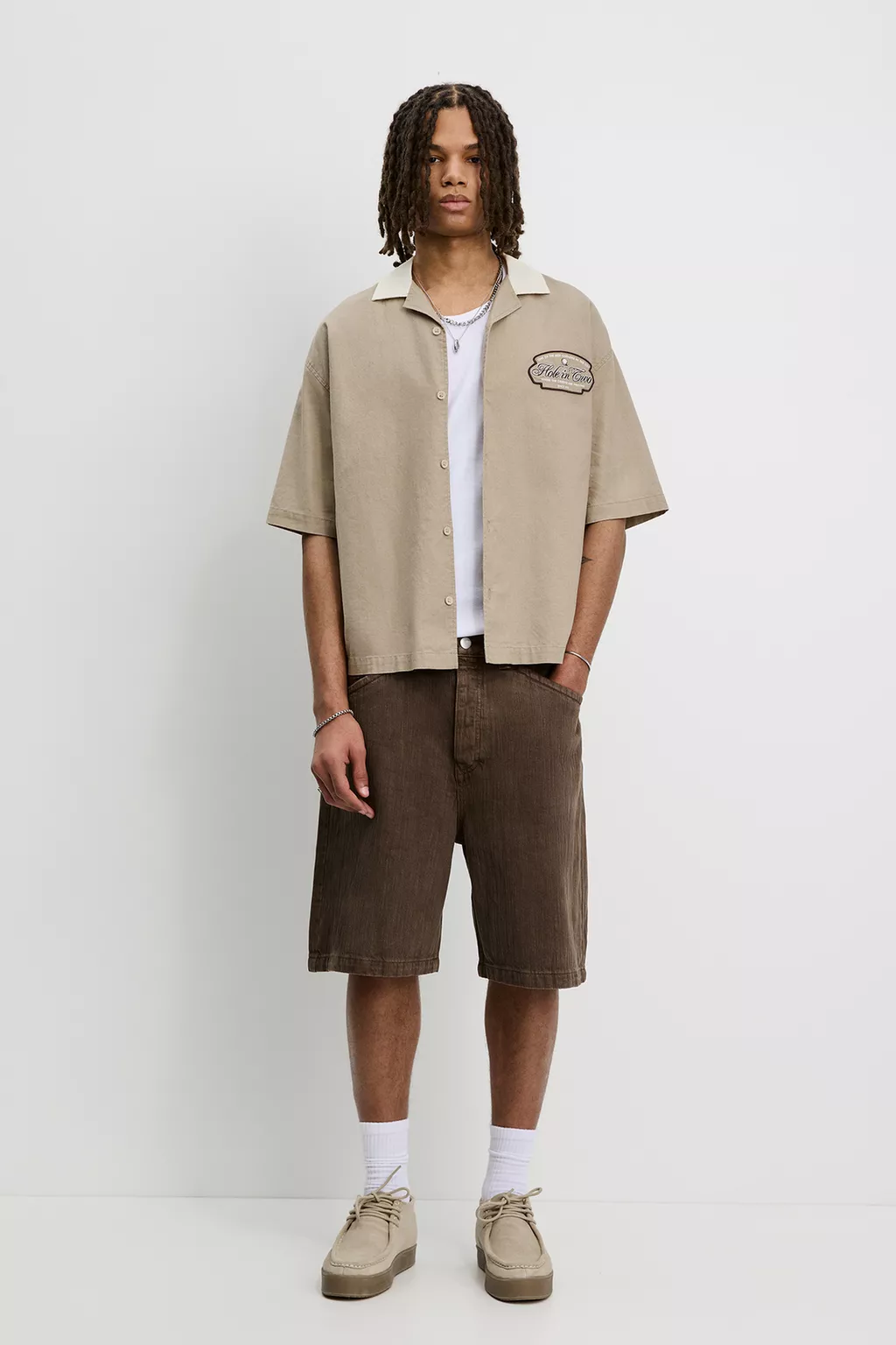 Short sleeve shirt with golf themed print