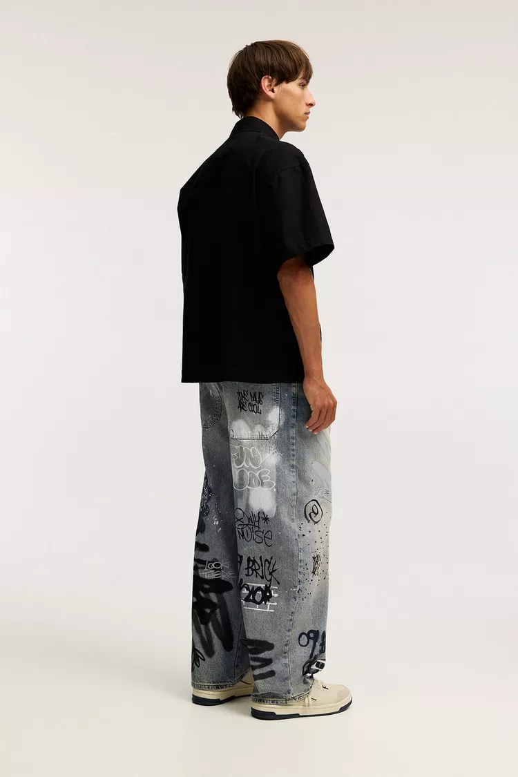 STWD graffiti patterned skater jeans