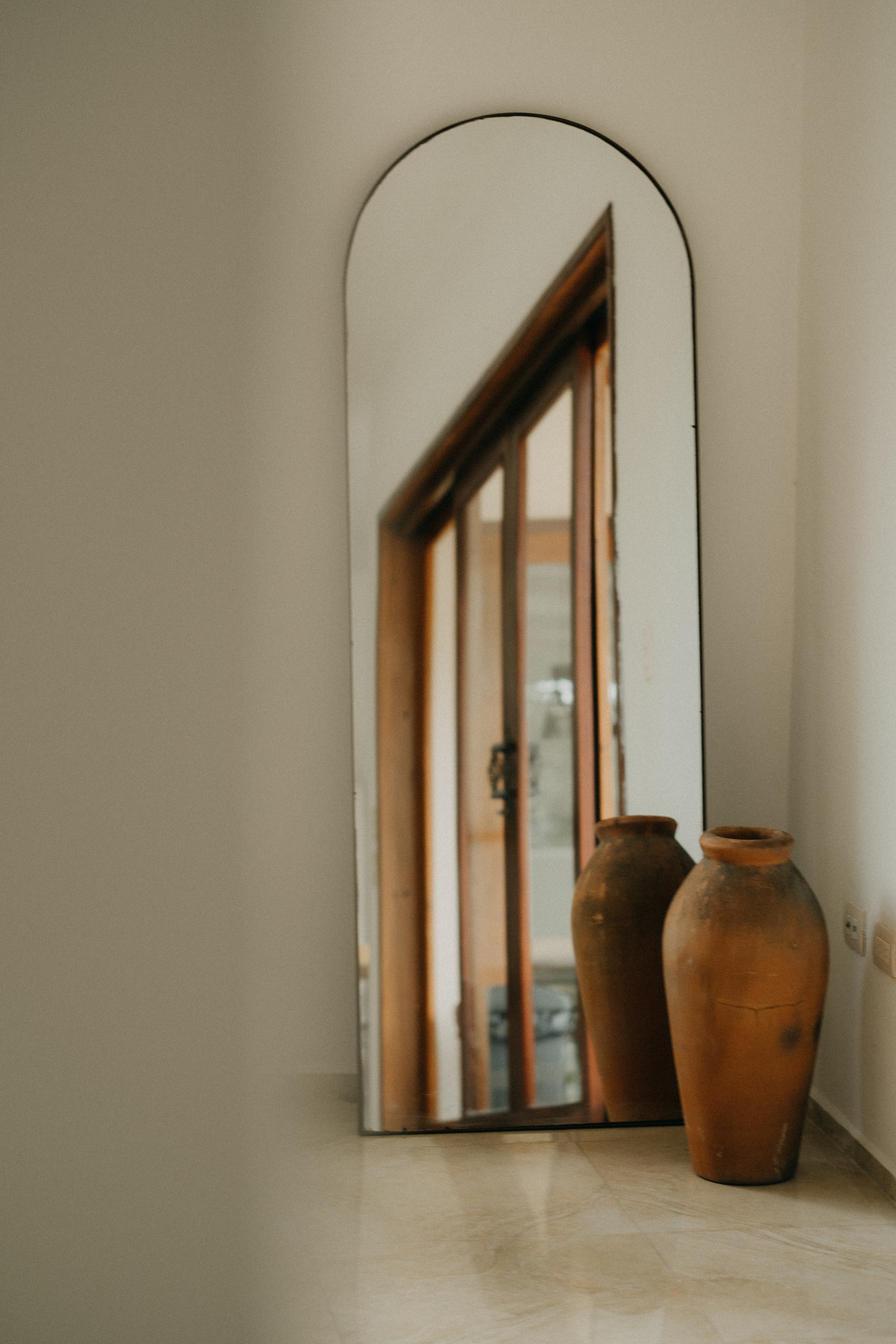 Arched full-length mirror