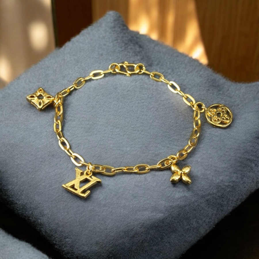 Gold Dangling Designer Charm Bracelet