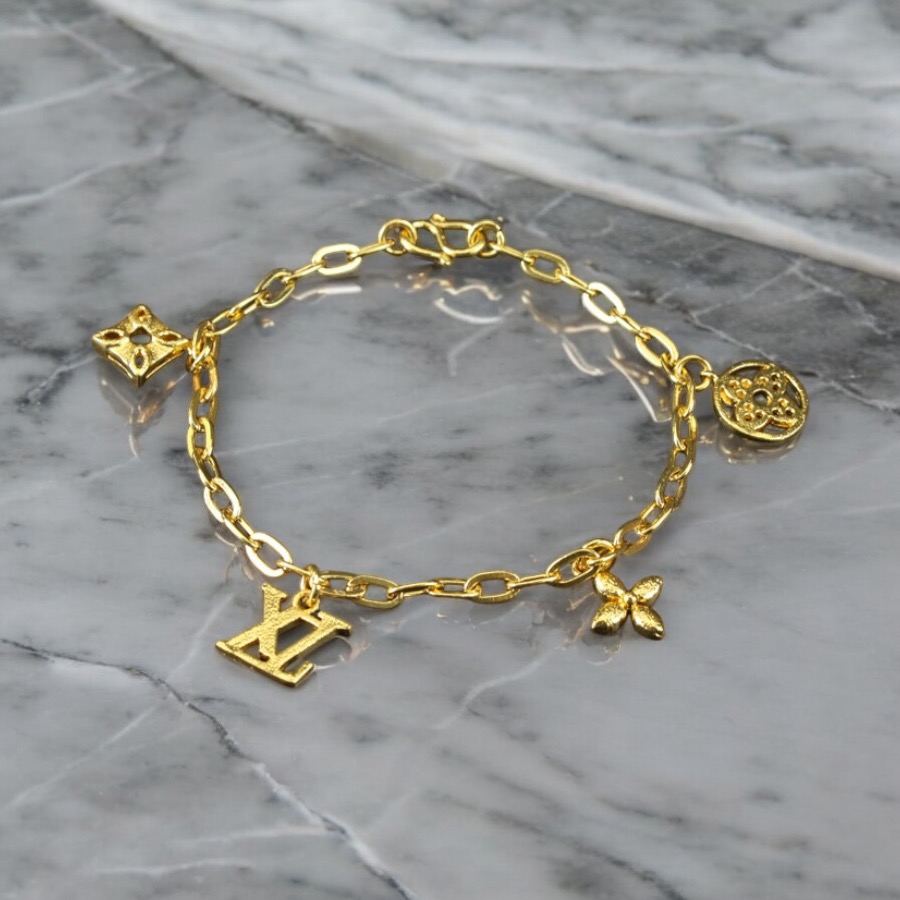 Gold Dangling Designer Charm Bracelet