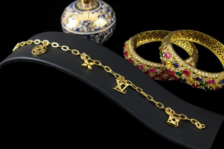 Gold Dangling Designer Charm Bracelet