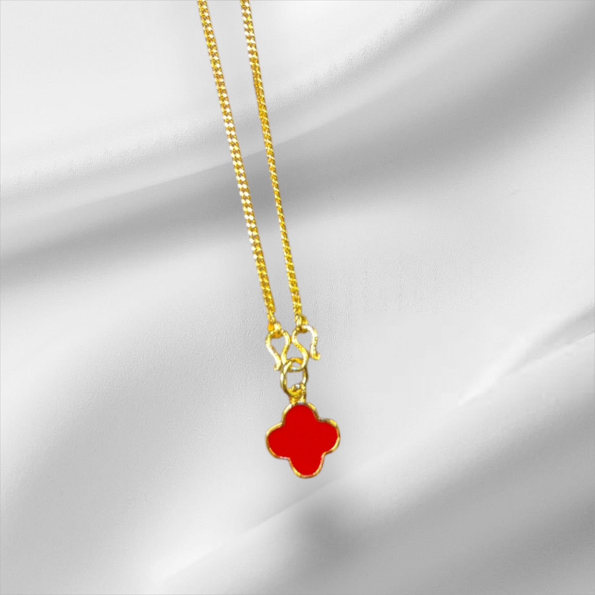 Elegant Gold Necklace with Red Clover Pendant