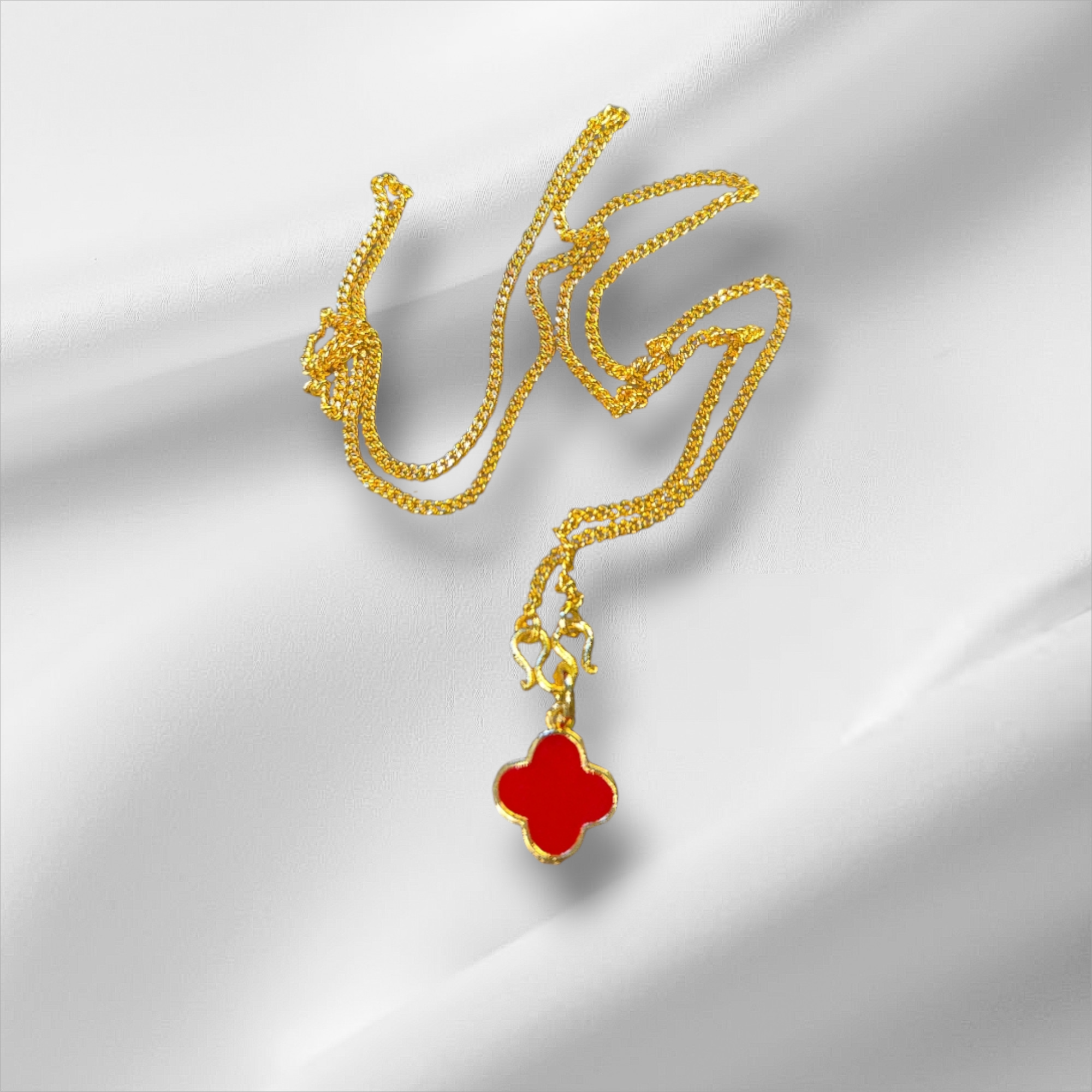 Elegant Gold Necklace with Red Clover Pendant