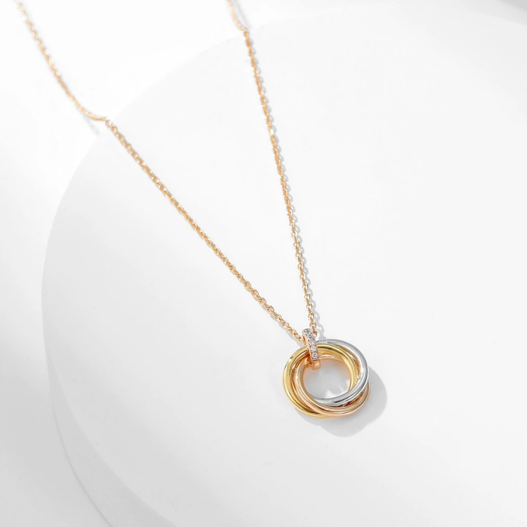 Trinity Radiance – Rose Gold Triple Ring Pendant Necklace