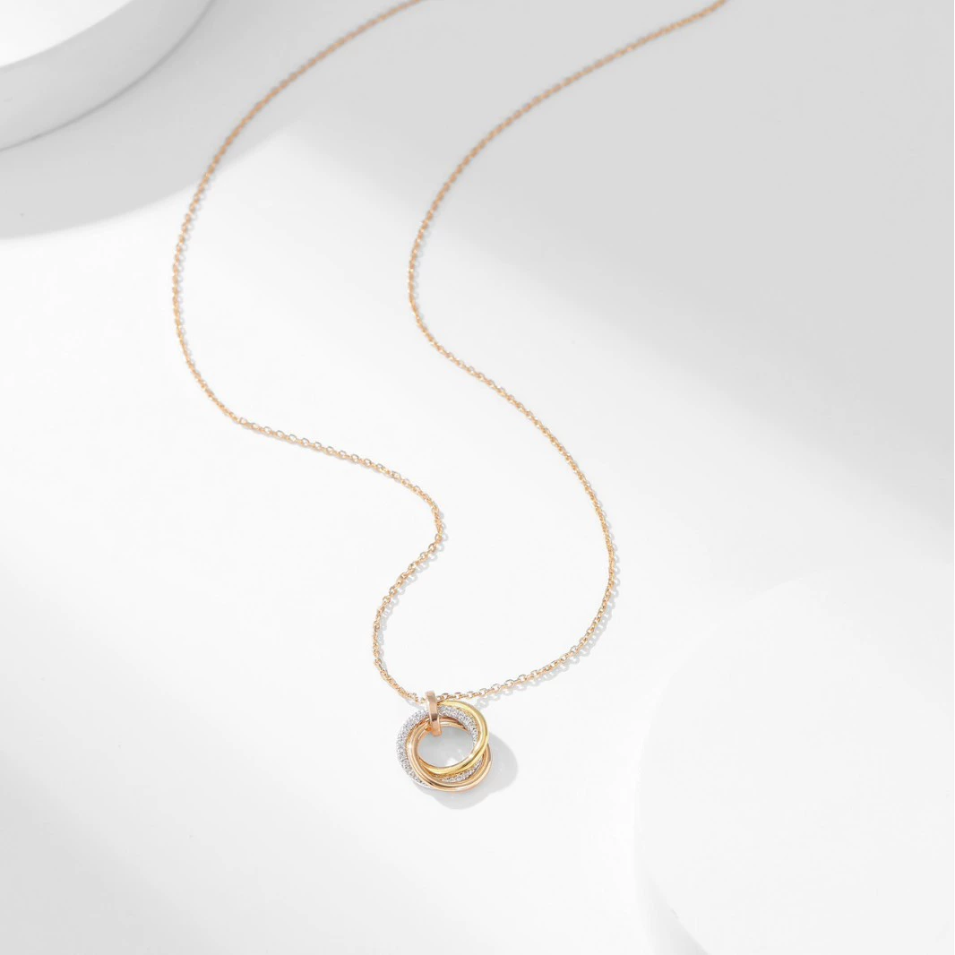 Trinity Radiance – Rose Gold Triple Ring Pendant Necklace