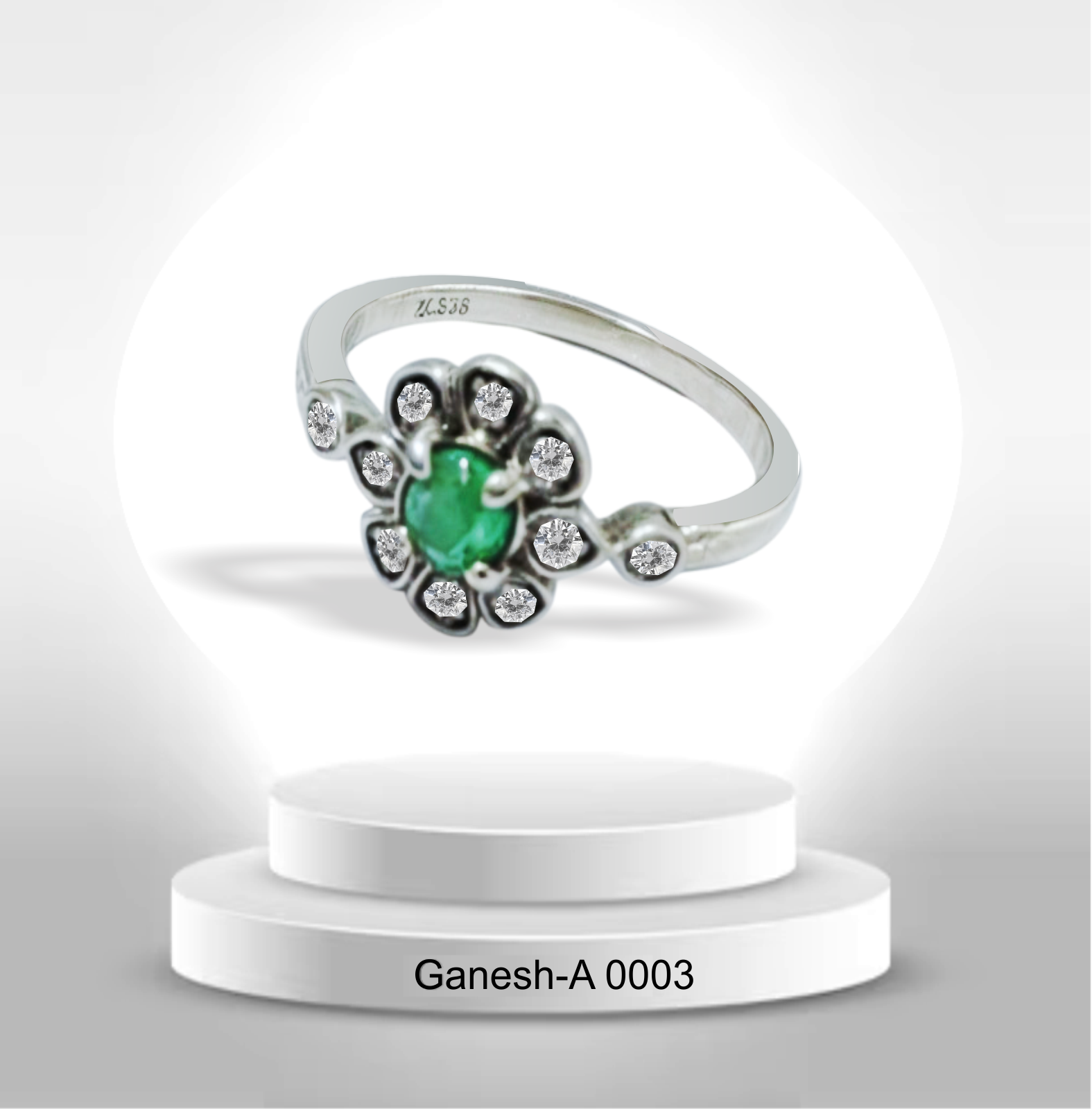 Anillo de plata con esmeralda y circones