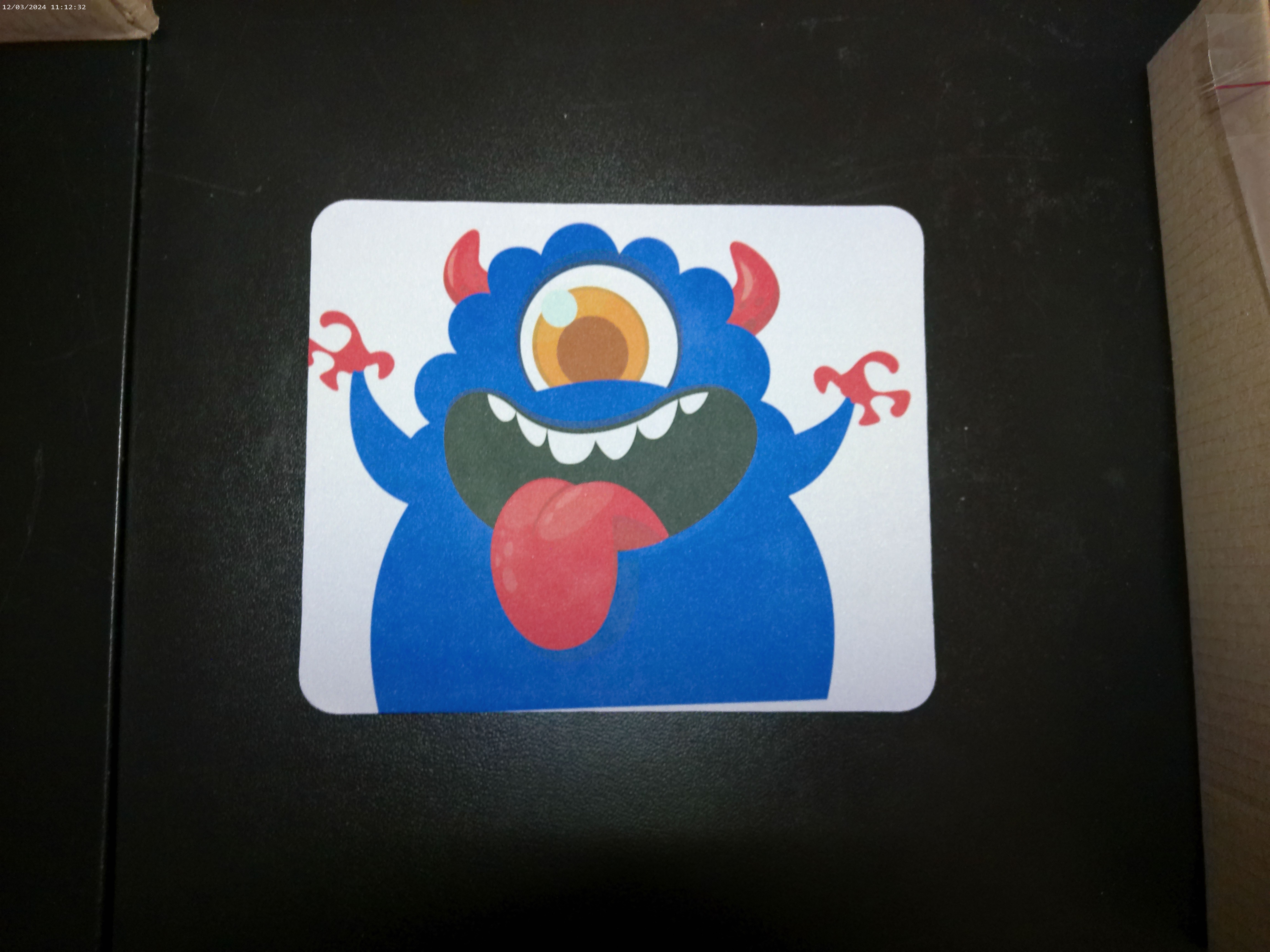 Blue fun monster with silly face mousepad