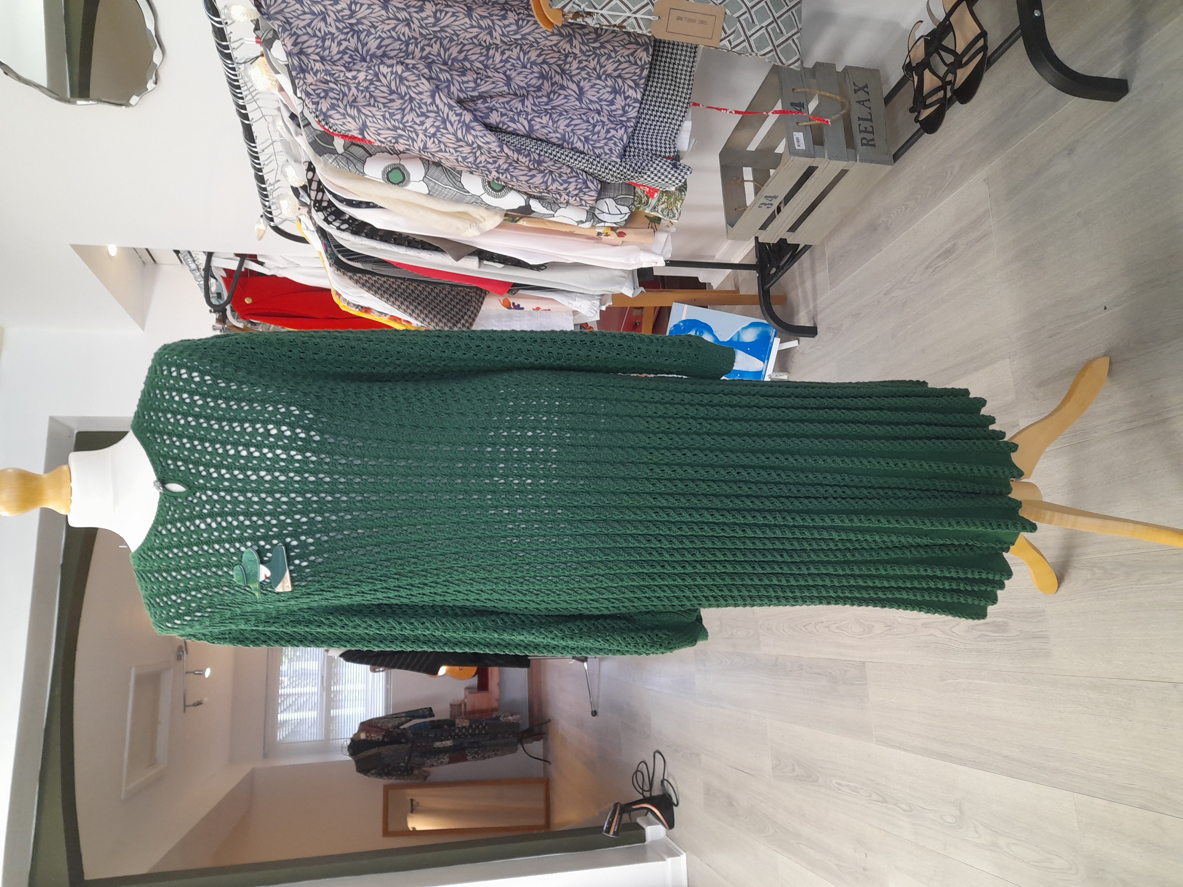 Knitted vintage green dress with a brooch 