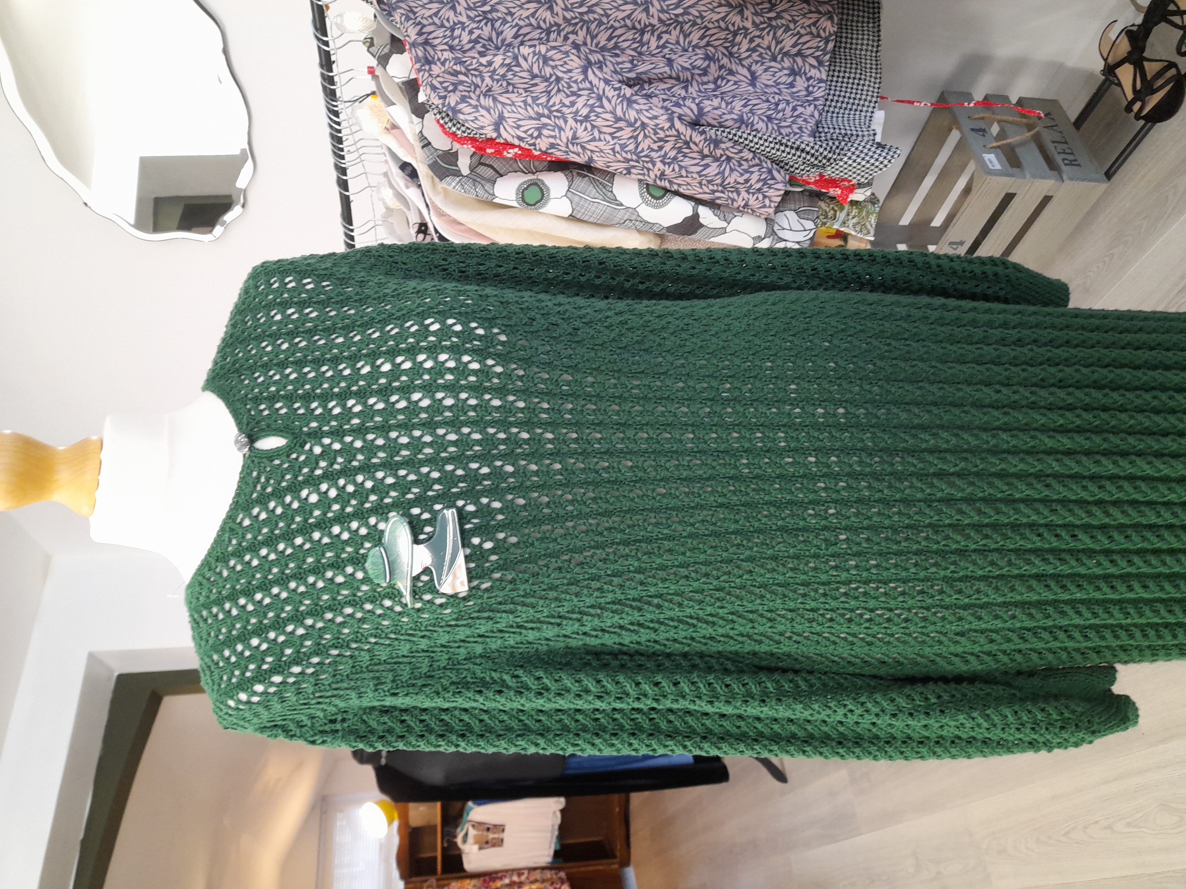 Knitted vintage green dress with a brooch 