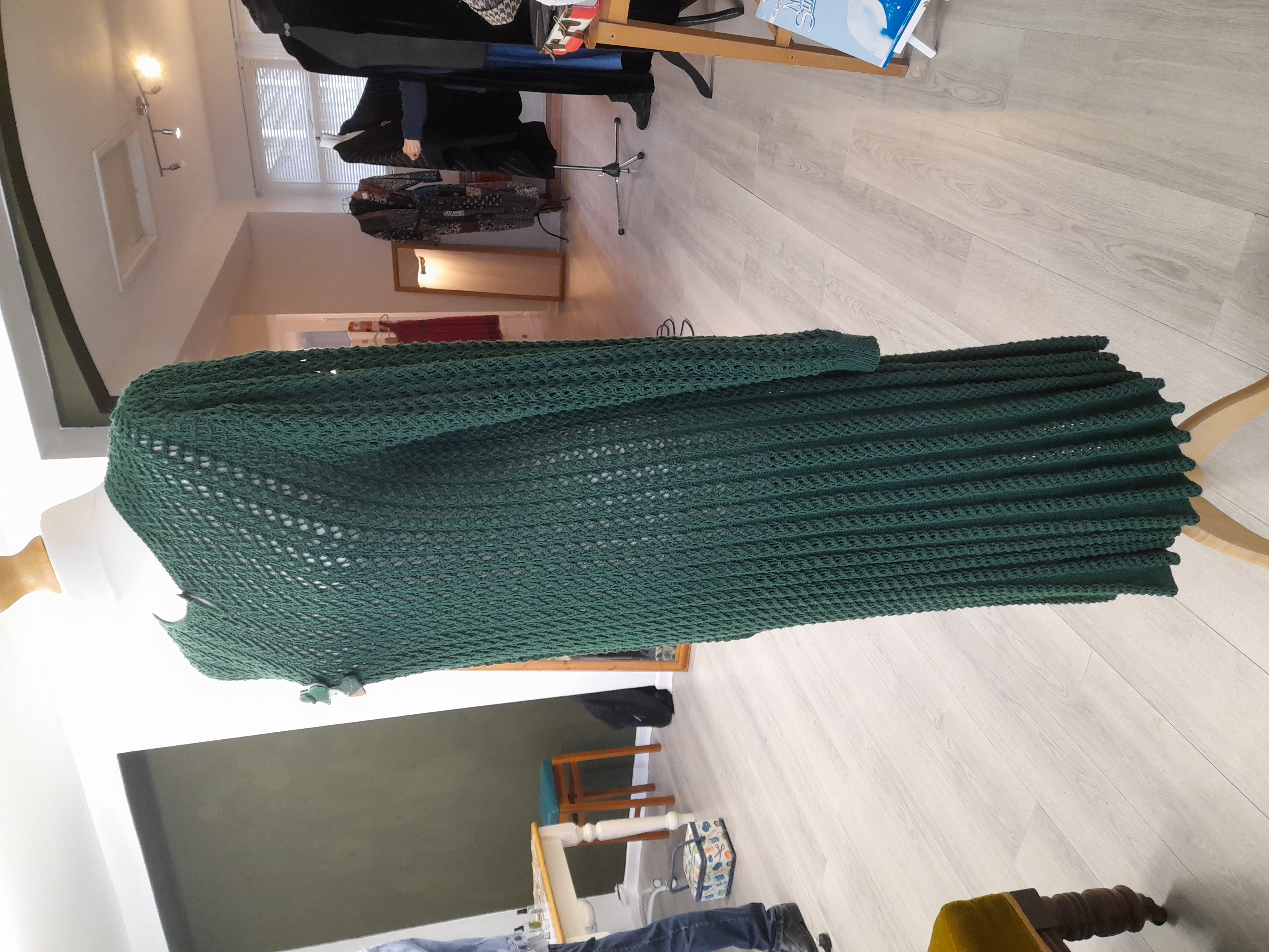 Knitted vintage green dress with a brooch 