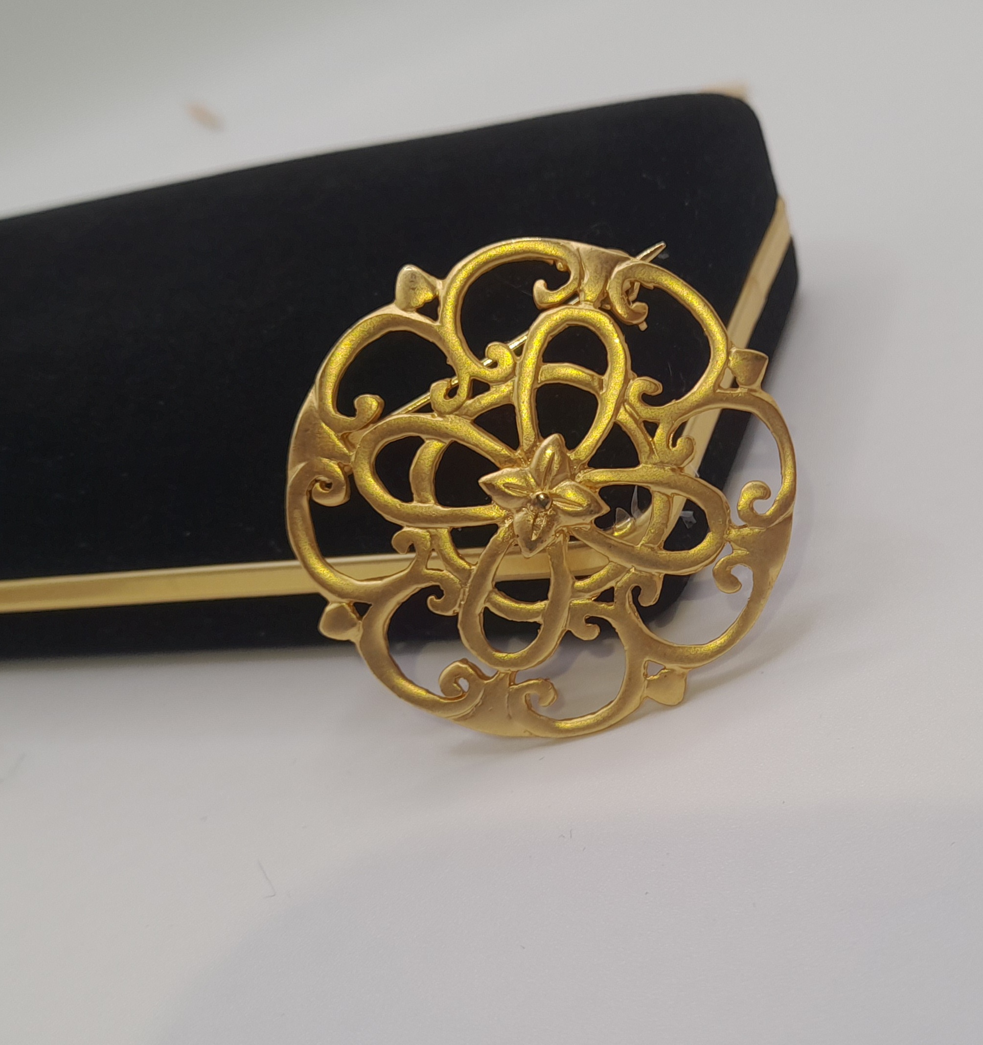 Vintage ornate gold tone brooch with trombone clasp