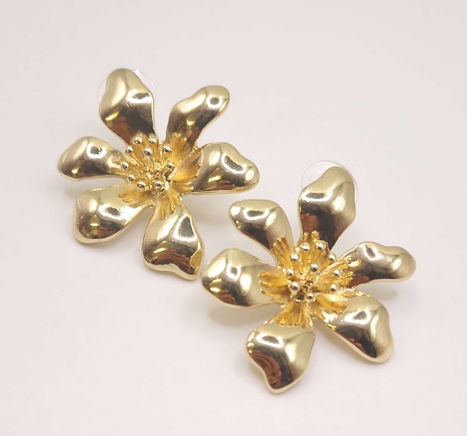 gold-plated statement flower stud earrings