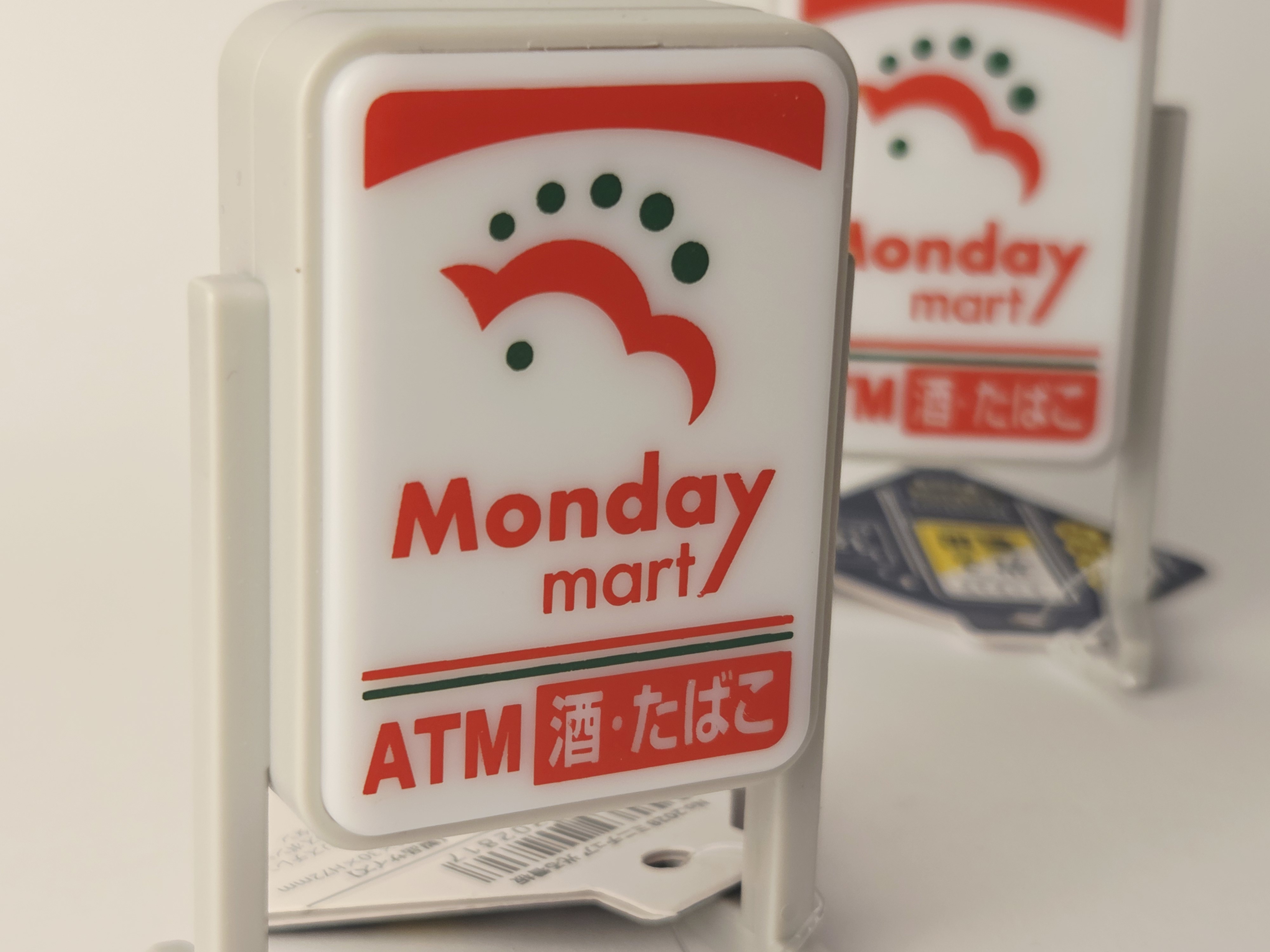 Miniatiūrinis šviečiantis Japonijos parduotuvės ženklas „Monday Mart“