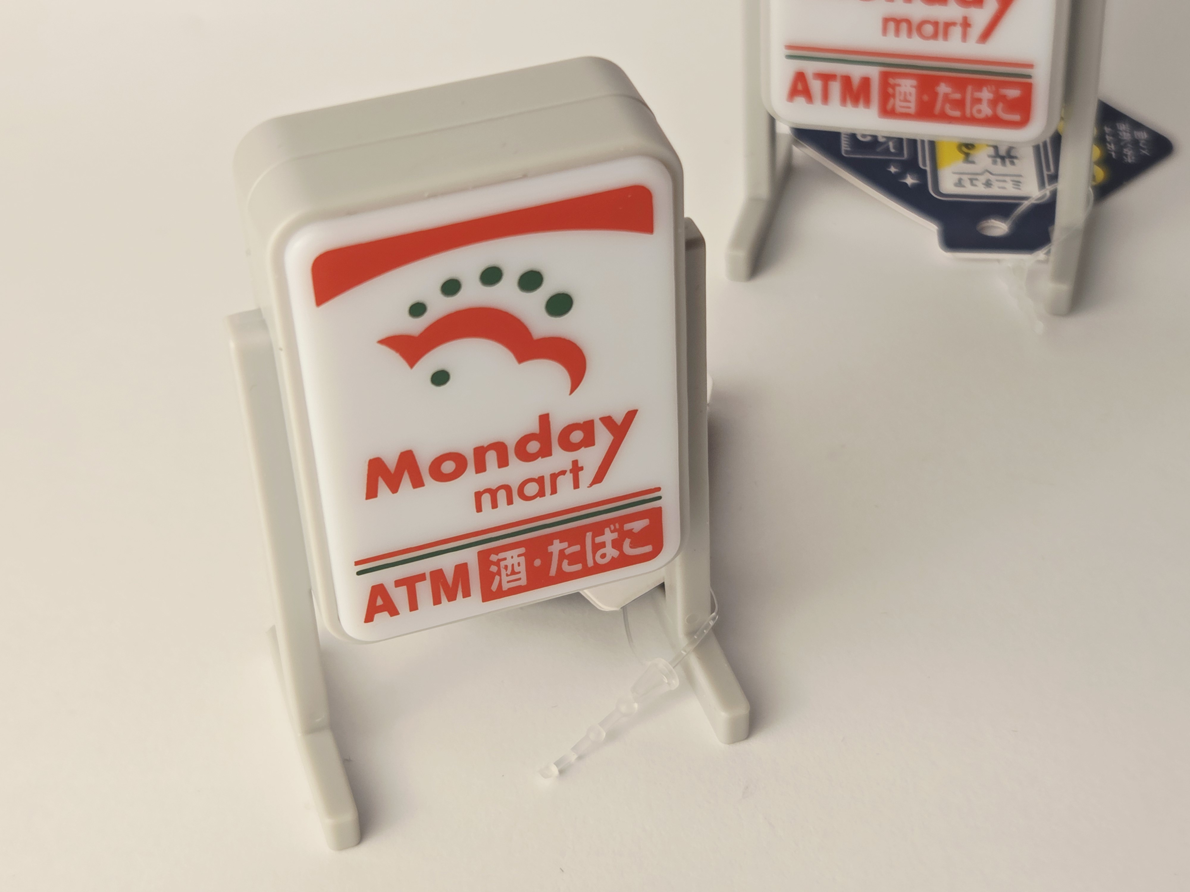 Miniatiūrinis šviečiantis Japonijos parduotuvės ženklas „Monday Mart“