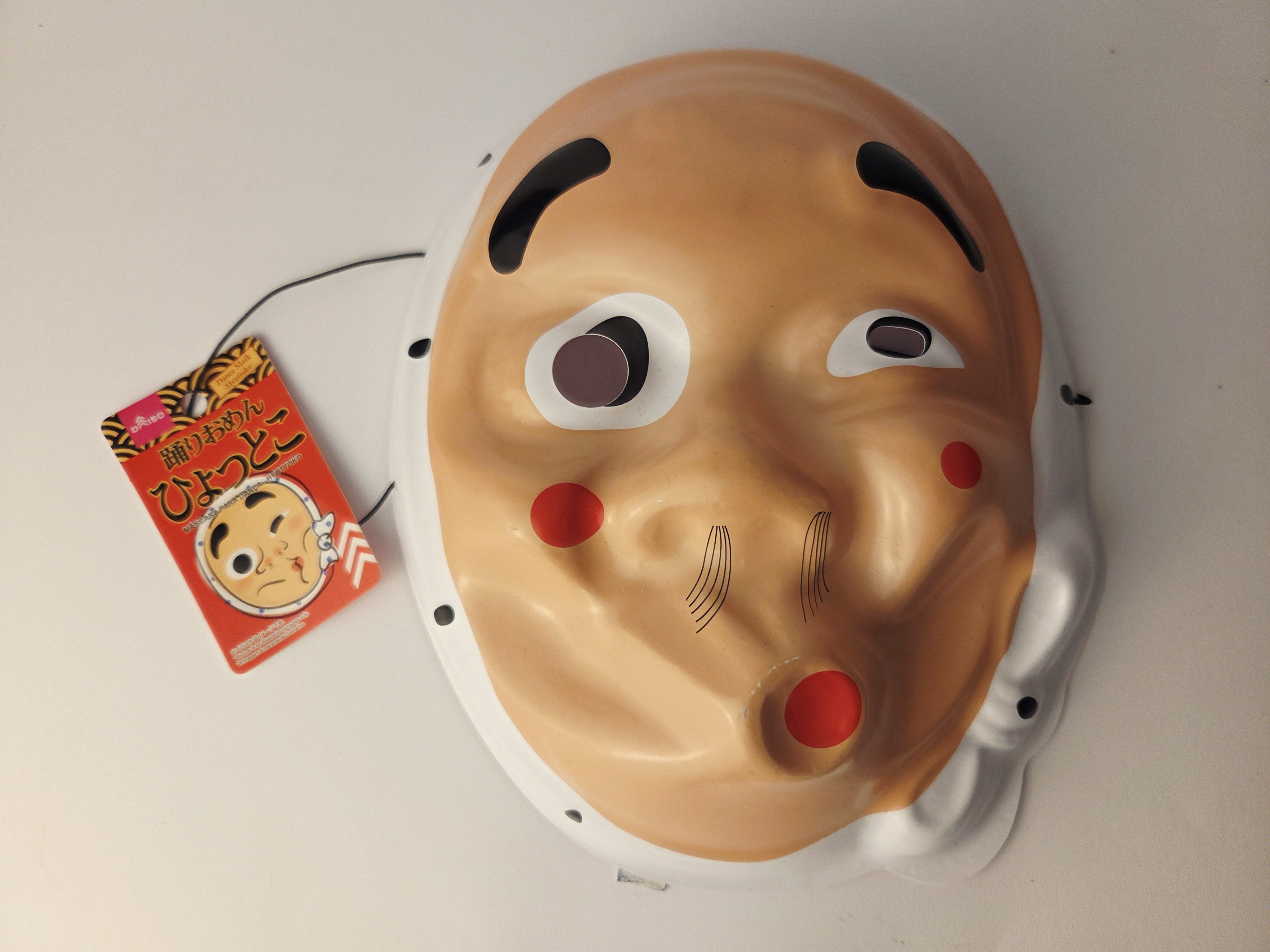 Japoniška Hyottoko plastikinė kaukė