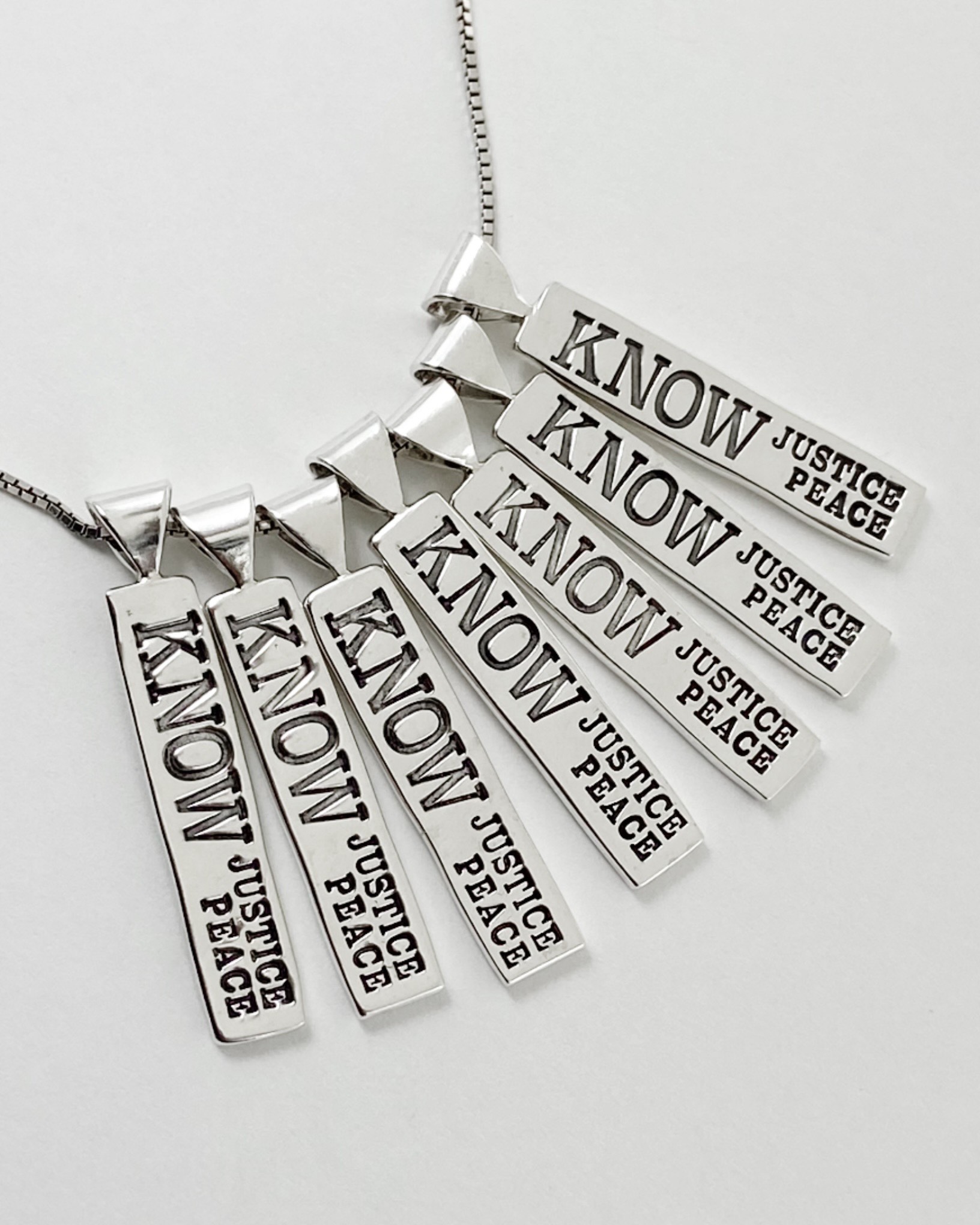 Know Justice Know Peace Pendant