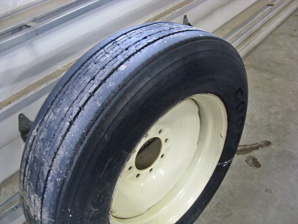 Goodyear 285/75/24.5 tire on 8 bolt implement rim