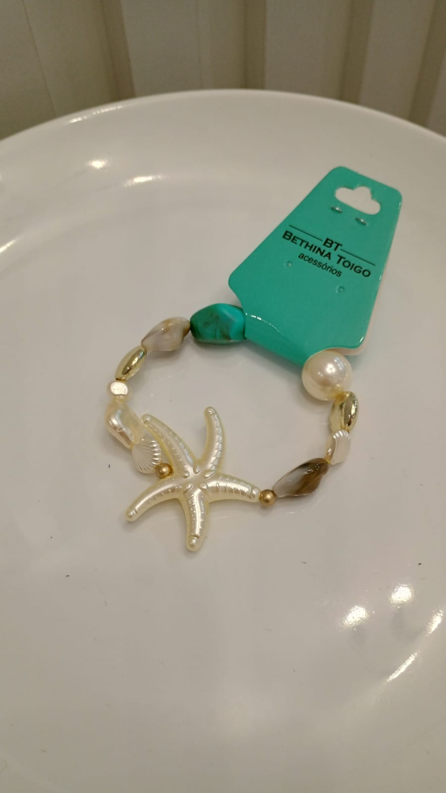 Pulseira com pingente de estrela-do-mar