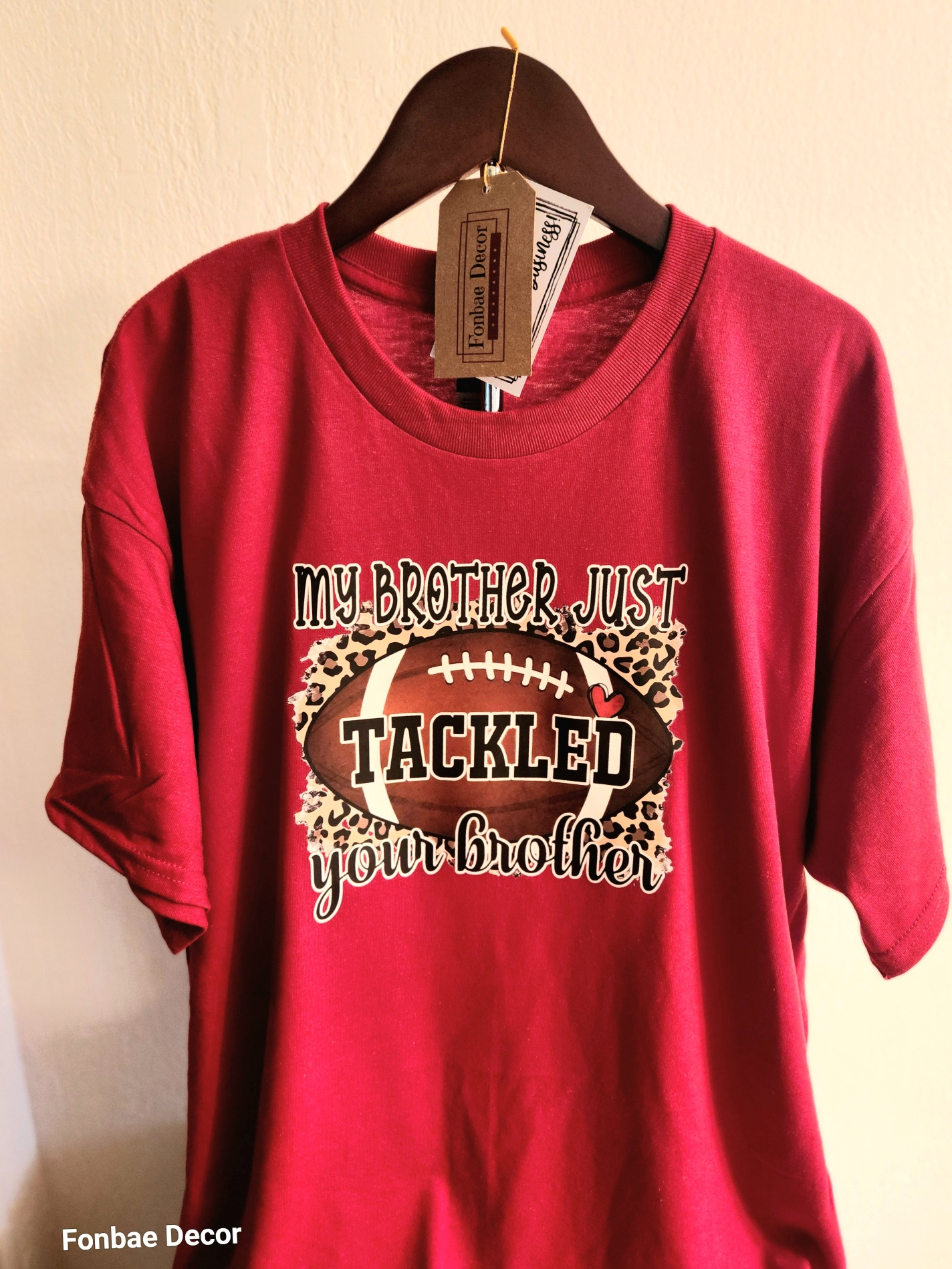 Stylish Fashion Cotton Football "Game-Day" Theme T-Shirt with design logo: My Brother Just Tackled Your Brother Colorful Vinyl Logo