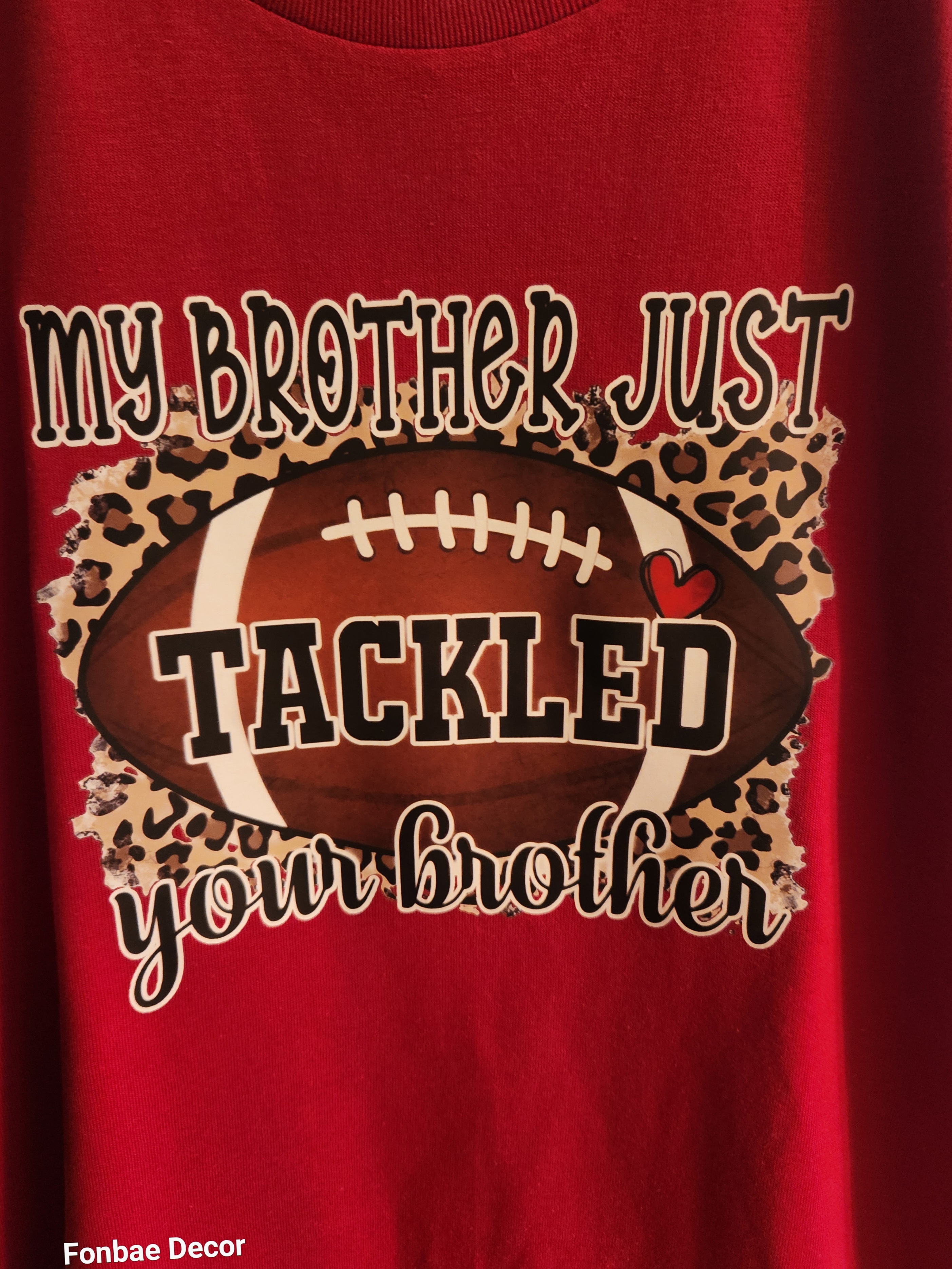Stylish Fashion Cotton Football "Game-Day" Theme T-Shirt with design logo: My Brother Just Tackled Your Brother Colorful Vinyl Logo