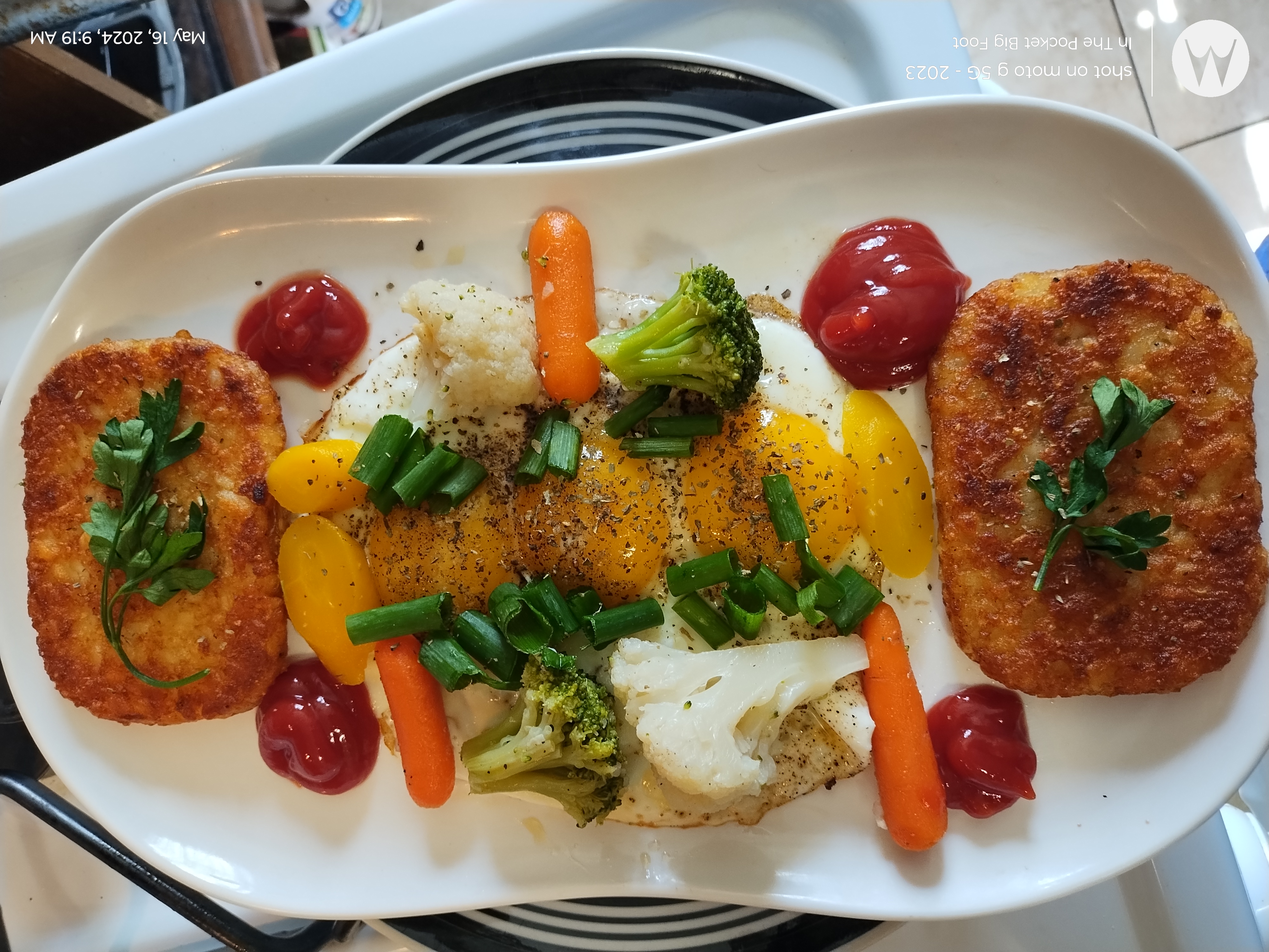  Breakfast Platter Hash browns three sunny side up eggs some carrots cauliflower a little basil