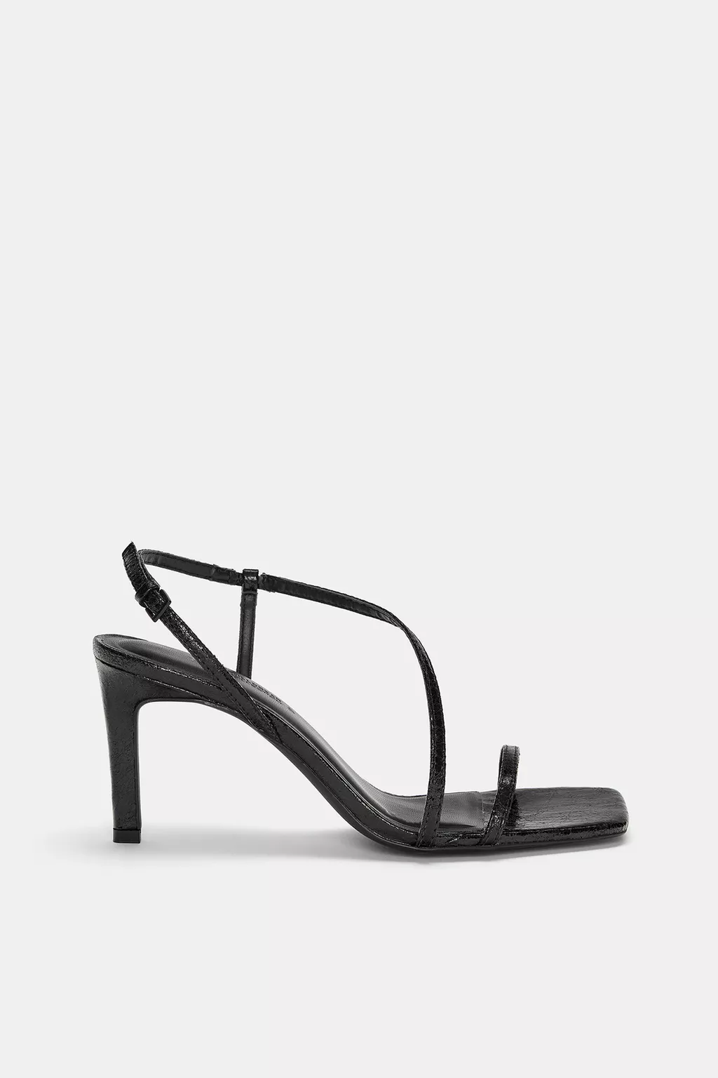 Heeled sandals with crossover straps