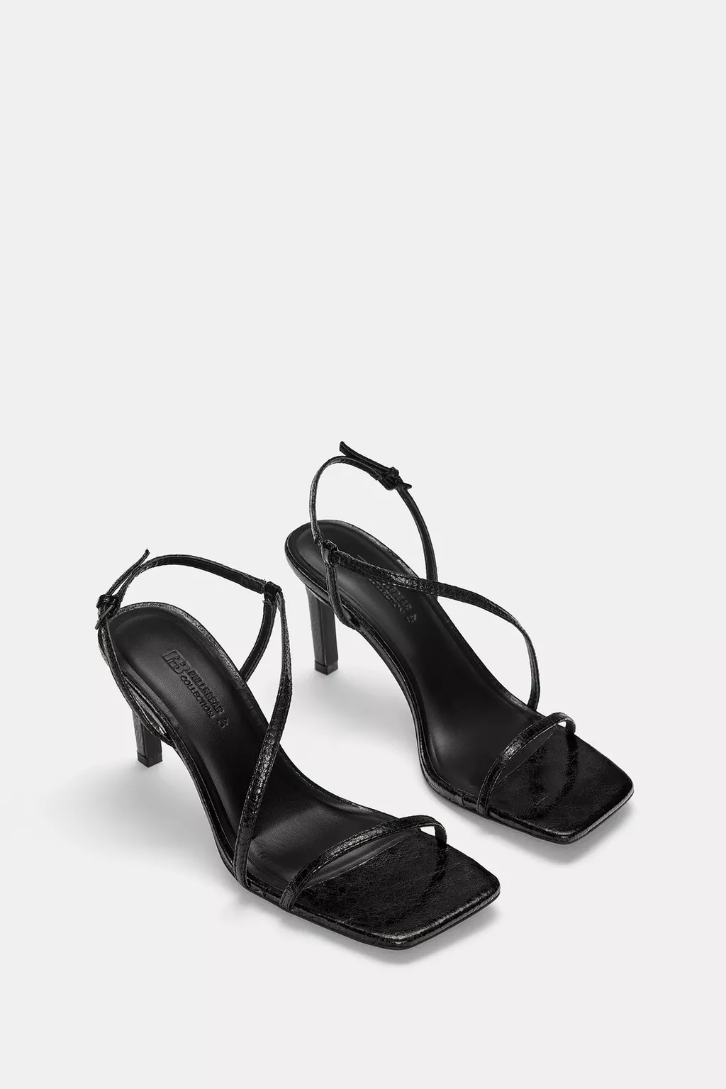 Heeled sandals with crossover straps