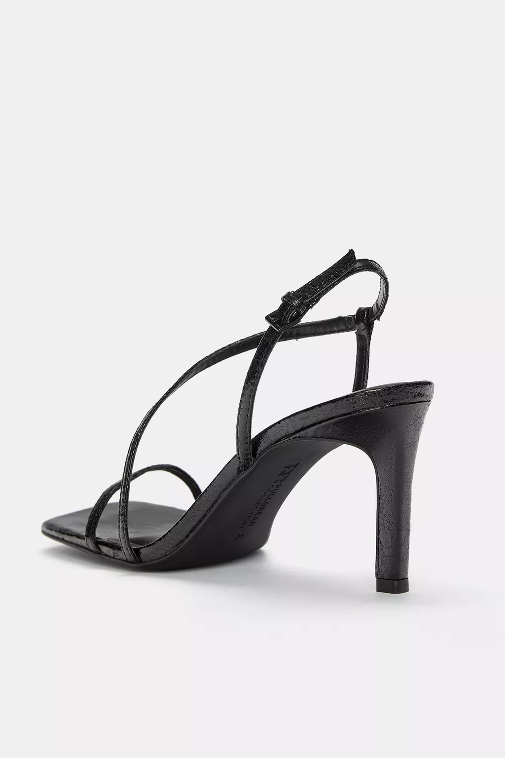 Heeled sandals with crossover straps