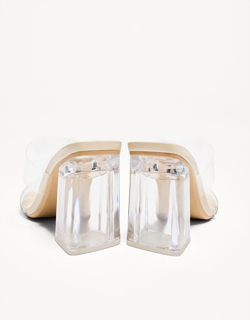 Heeled sandals with vinyl straps